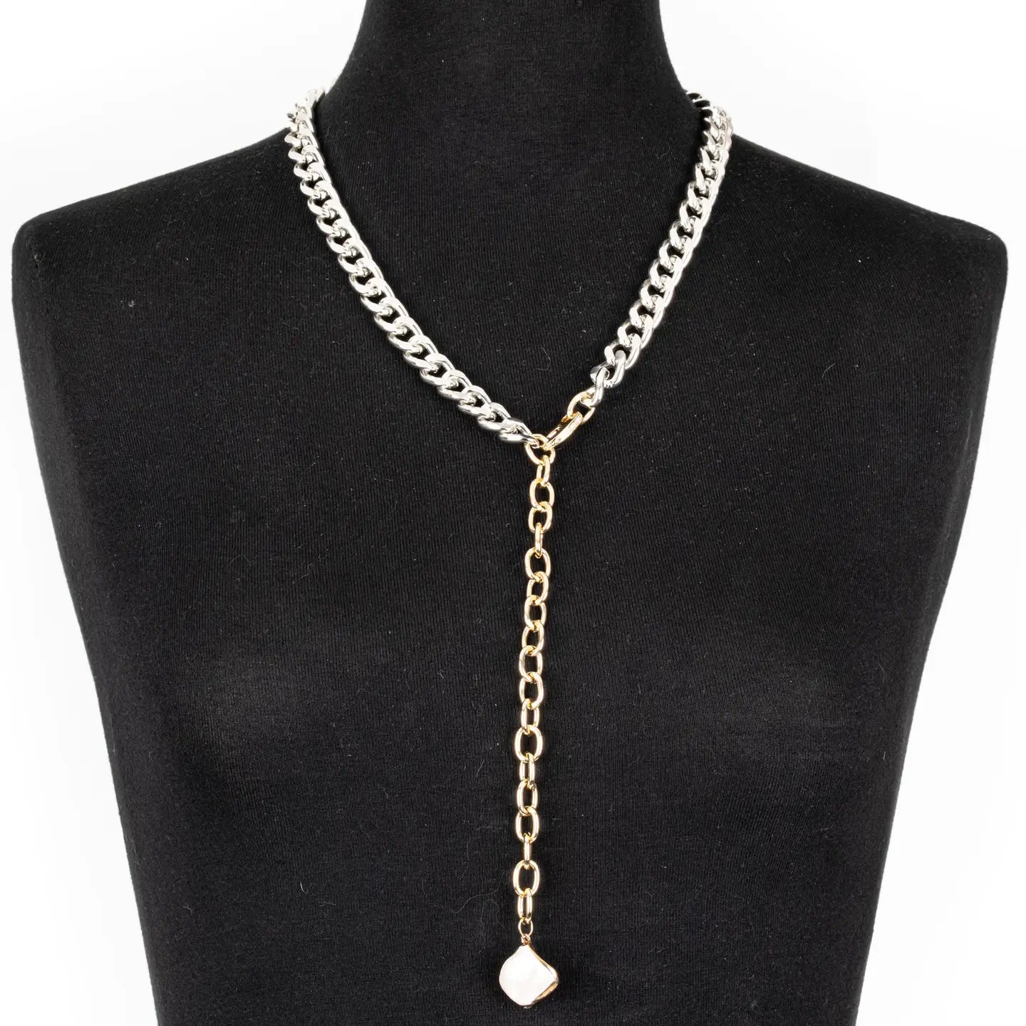 Two-tone silver and gold chain Y necklace with white stone pendant on white background.