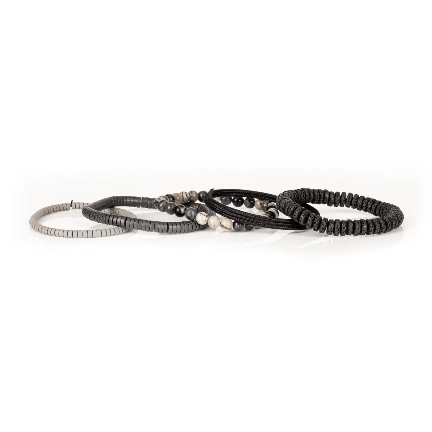 Men’s layered bracelet set featuring black lava stone disc beads, black braided cord wraps, white and gray marbled natural stone beads, black hematite coil beads, and light gray heishi beads, stacked in a sophisticated monochromatic luxury design on a white background.