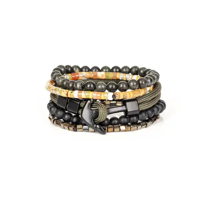 Men’s layered bracelet set featuring black natural stone beads, matte black onyx-style beads, multicolor heishi beads in warm earth tones, olive braided cord wraps, and metallic hematite spacer beads, stacked in a contemporary bohemian luxury design on a white background.