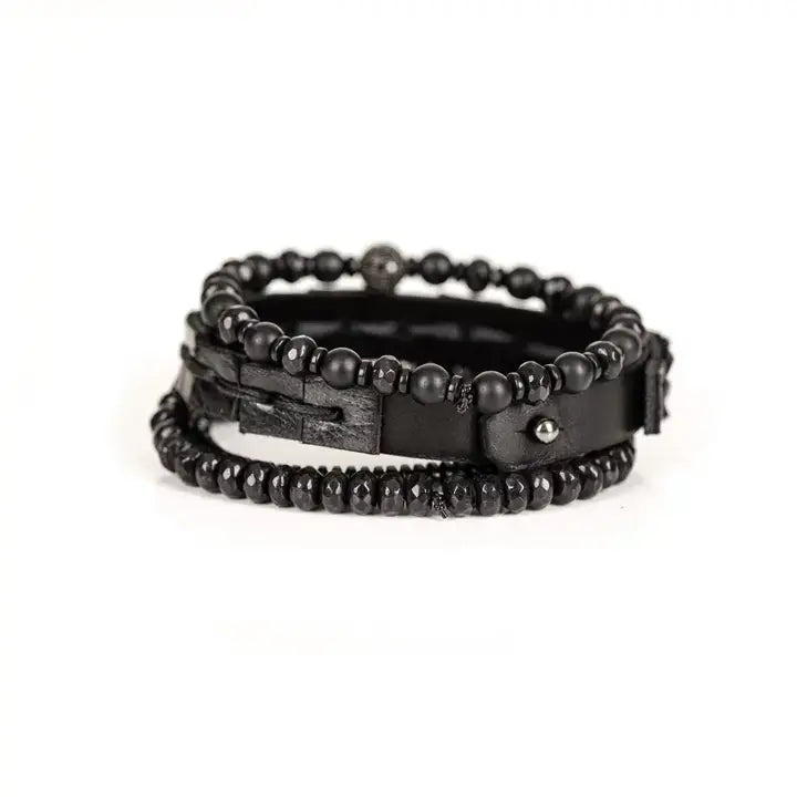 Black multi-layer men’s bracelet featuring woven leather band, matte onyx beads, faceted black crystal stones, crystal centerpiece accent, and hematite bead strand on a light background.