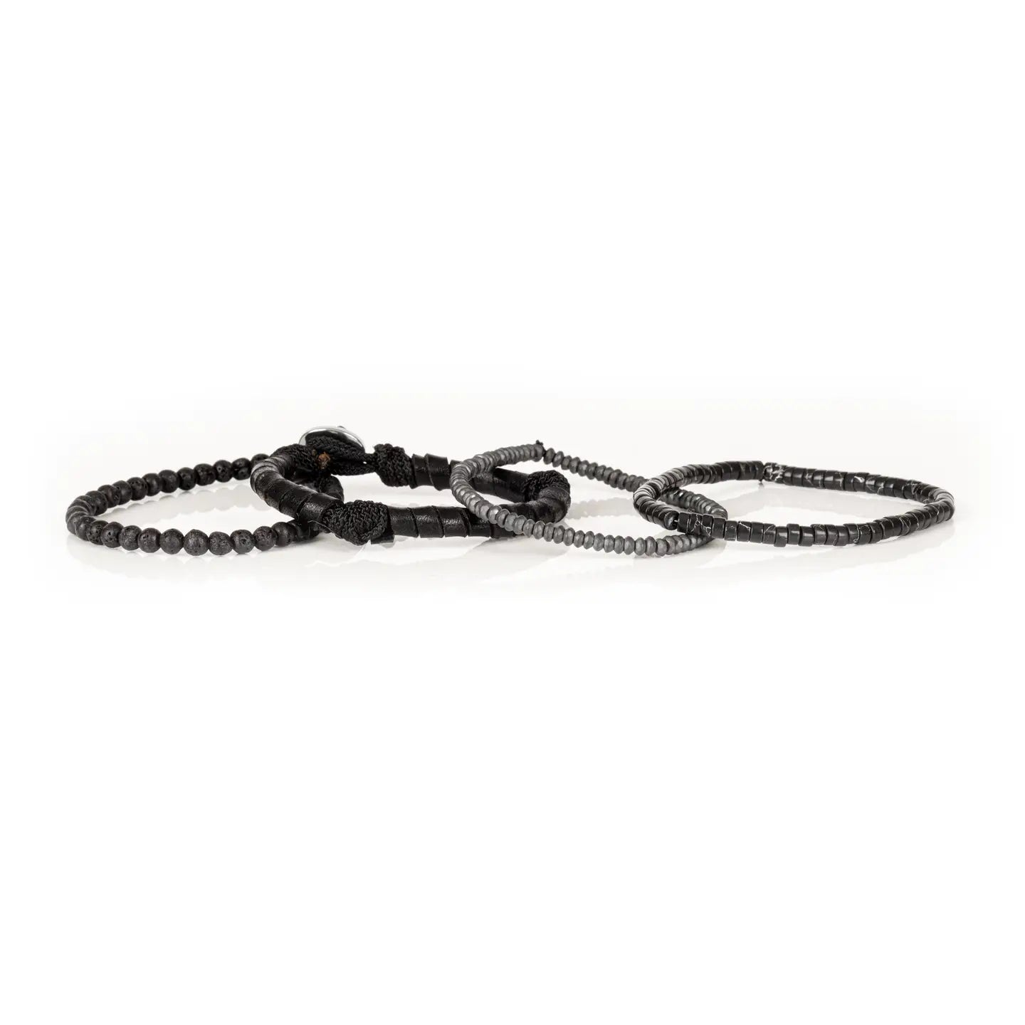 Men’s layered bracelet set featuring matte black lava stone beads, black leather-wrapped cord, black marbled heishi beads, faceted gray crystal beads, and dark metallic spacer beads, stacked in a sleek monochromatic luxury design on a white background.
