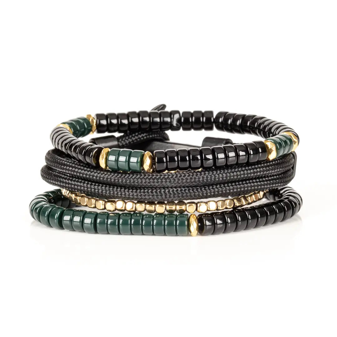 Men’s layered bracelet set featuring black and deep green heishi beads, black braided cord wraps, gold-tone spacer beads, and polished black accent beads, stacked in a sophisticated green, black, and gold luxury design on a white background.