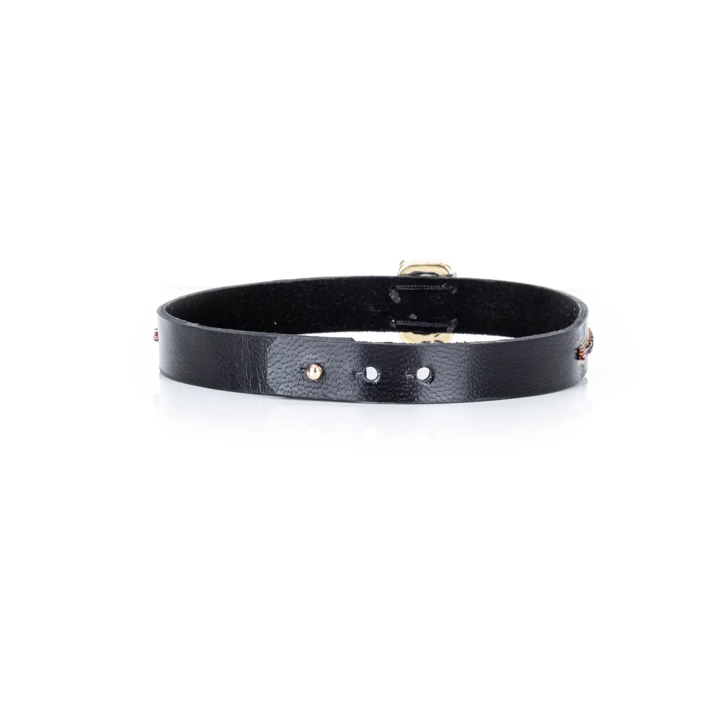 Black leather choker with a central brown rectangular crystal and fine rhinestone and gold detailing along the band, displayed on a white background.