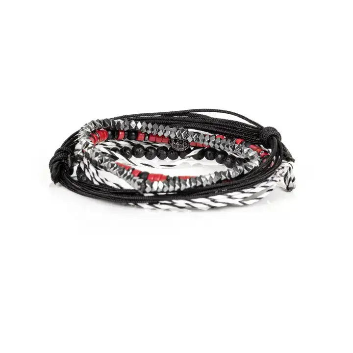 Black and red layered men’s bracelet set with lava stone beads, braided rope wraps, metallic accents, and pavé centerpiece on white background.