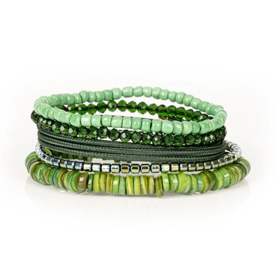 Men’s layered bracelet set featuring mint green seed beads, faceted dark green crystal beads, olive braided cord wraps, silver-tone hematite spacer beads, and green natural shell heishi beads, stacked in a fresh nature-inspired luxury design on a white background.