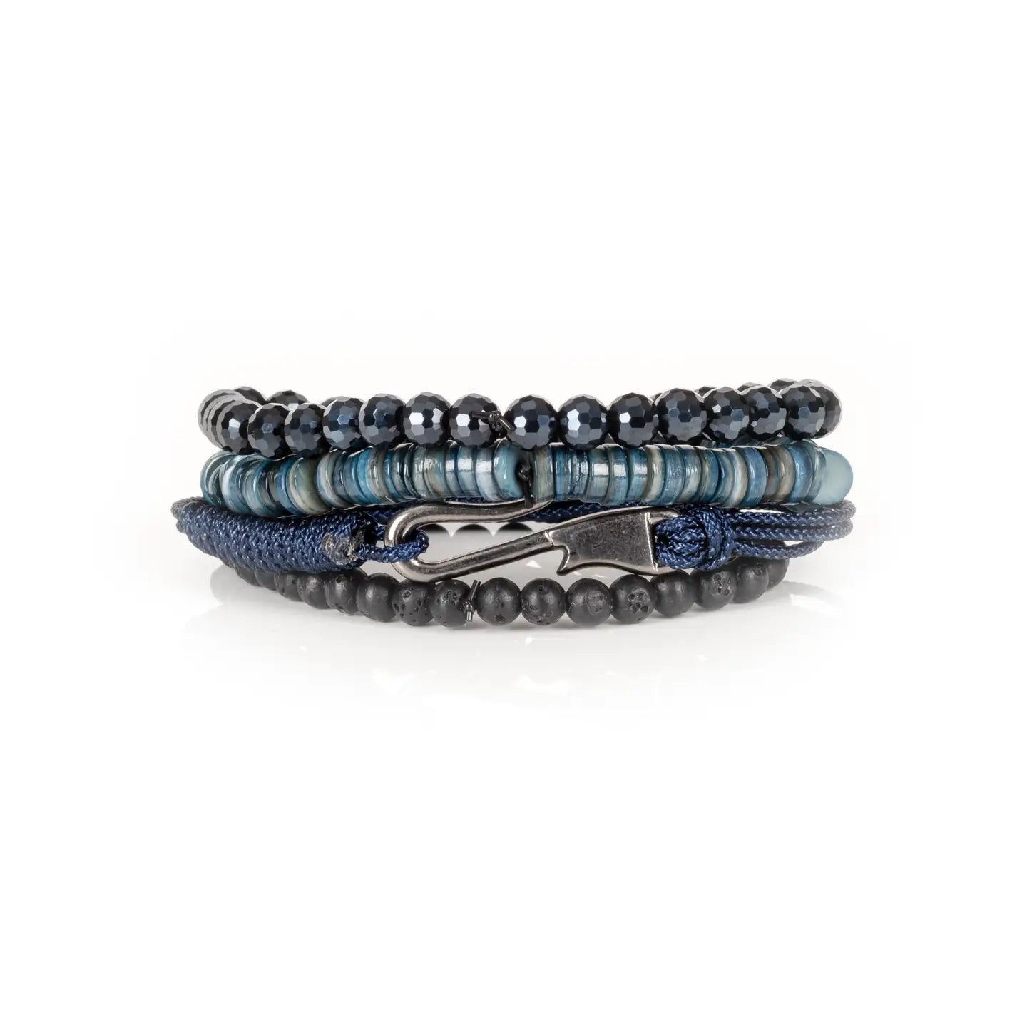 Men's layered bracelet set featuring faceted black crystal beads, blue heishi stone beads, navy woven cord, and matte black lava stone beads arranged in a stacked design on a white background.