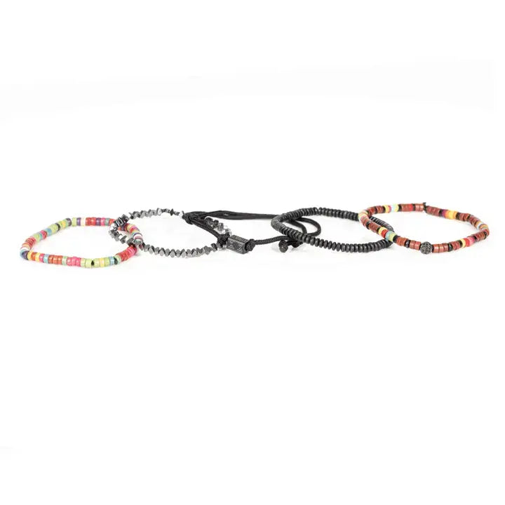 Multicolor multi-layer men’s bracelet featuring colorful disc bead strands, faceted hematite accents, braided black rope layers, and black geometric centerpiece on a light background.