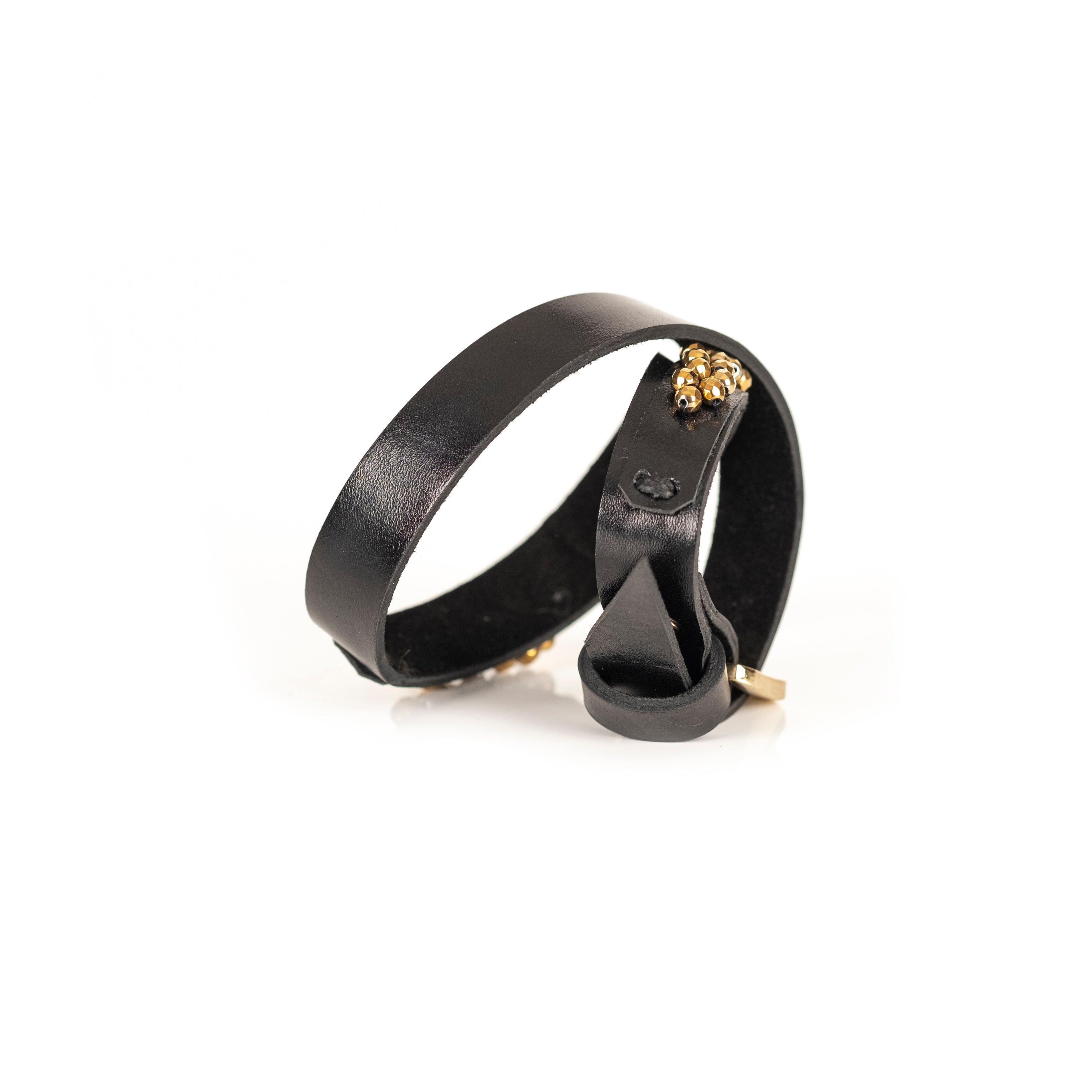 Black leather bracelet with gold bead trim and geometric metal accents, handmade statement bracelet by THE DARK