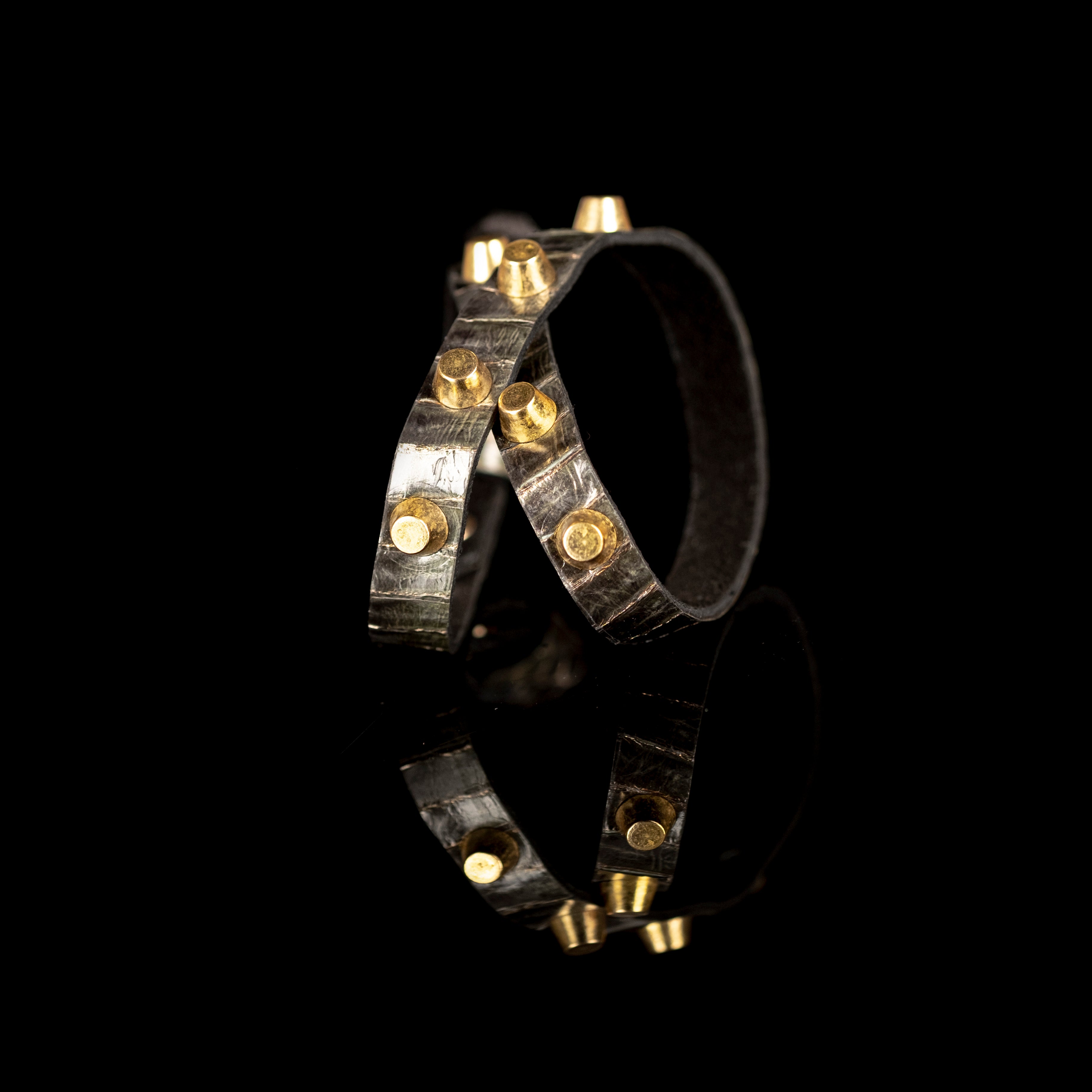 Black leather bracelet with metallic texture straps and gold cone studs, handmade statement bracelet by THE DARK