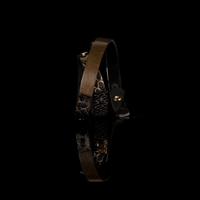 Layered leather choker with metallic gold python texture, bronze strap, and rivet detailing