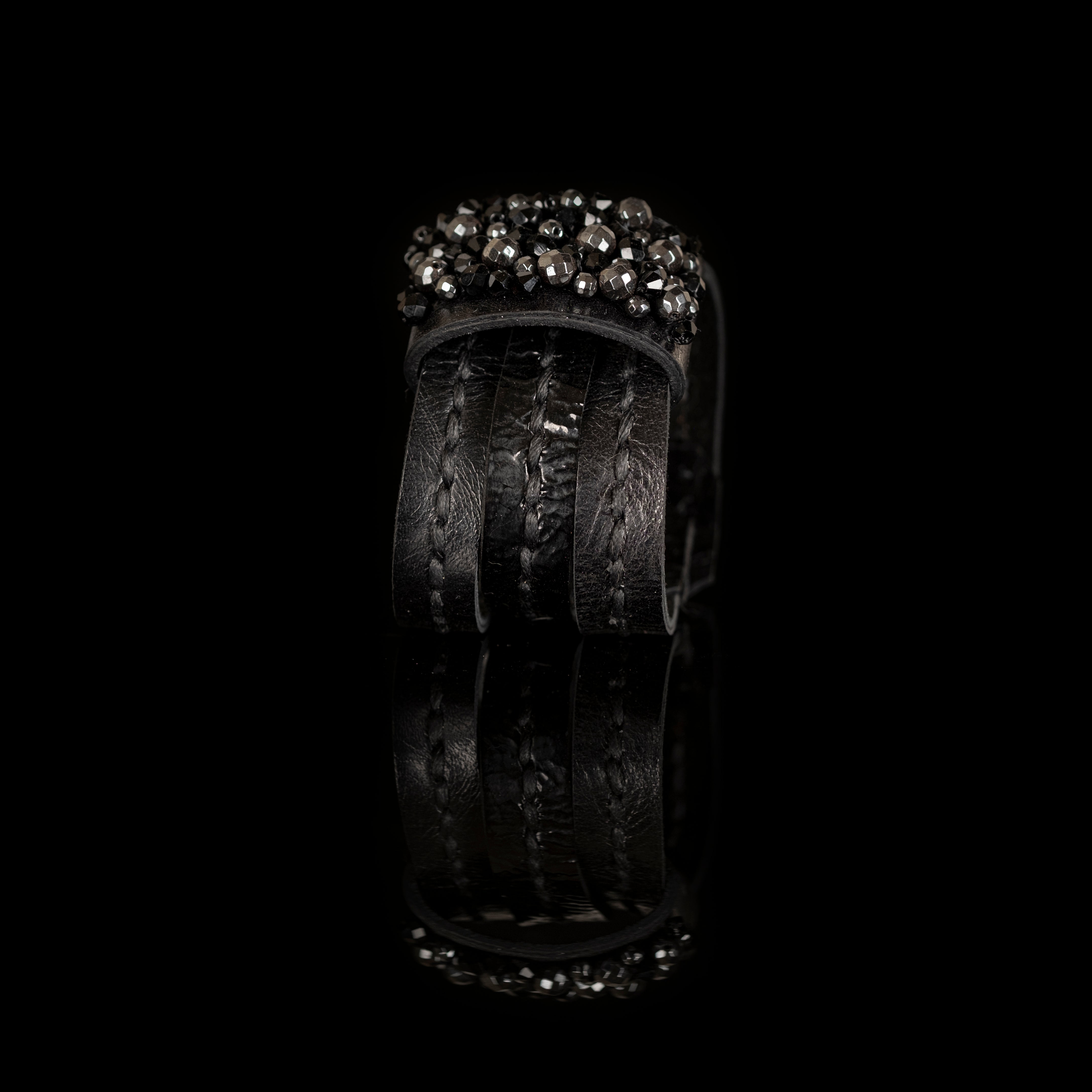 Black leather cuff bracelet with dense black crystal crown and layered textured leather bands, handmade bracelet by THE DARK