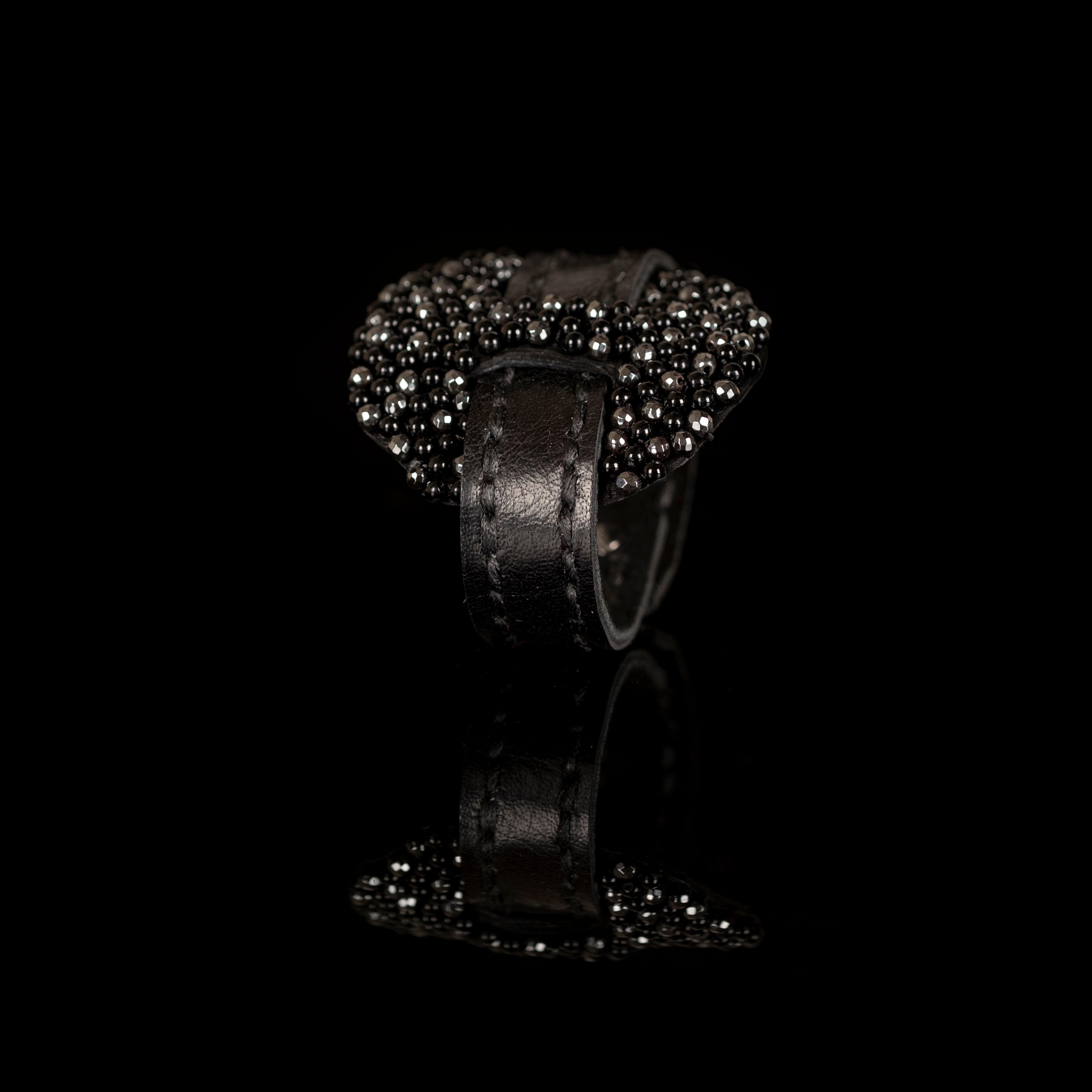 Black leather bracelet with dense cluster of black beads and crystals, handmade statement bracelet by THE DARK