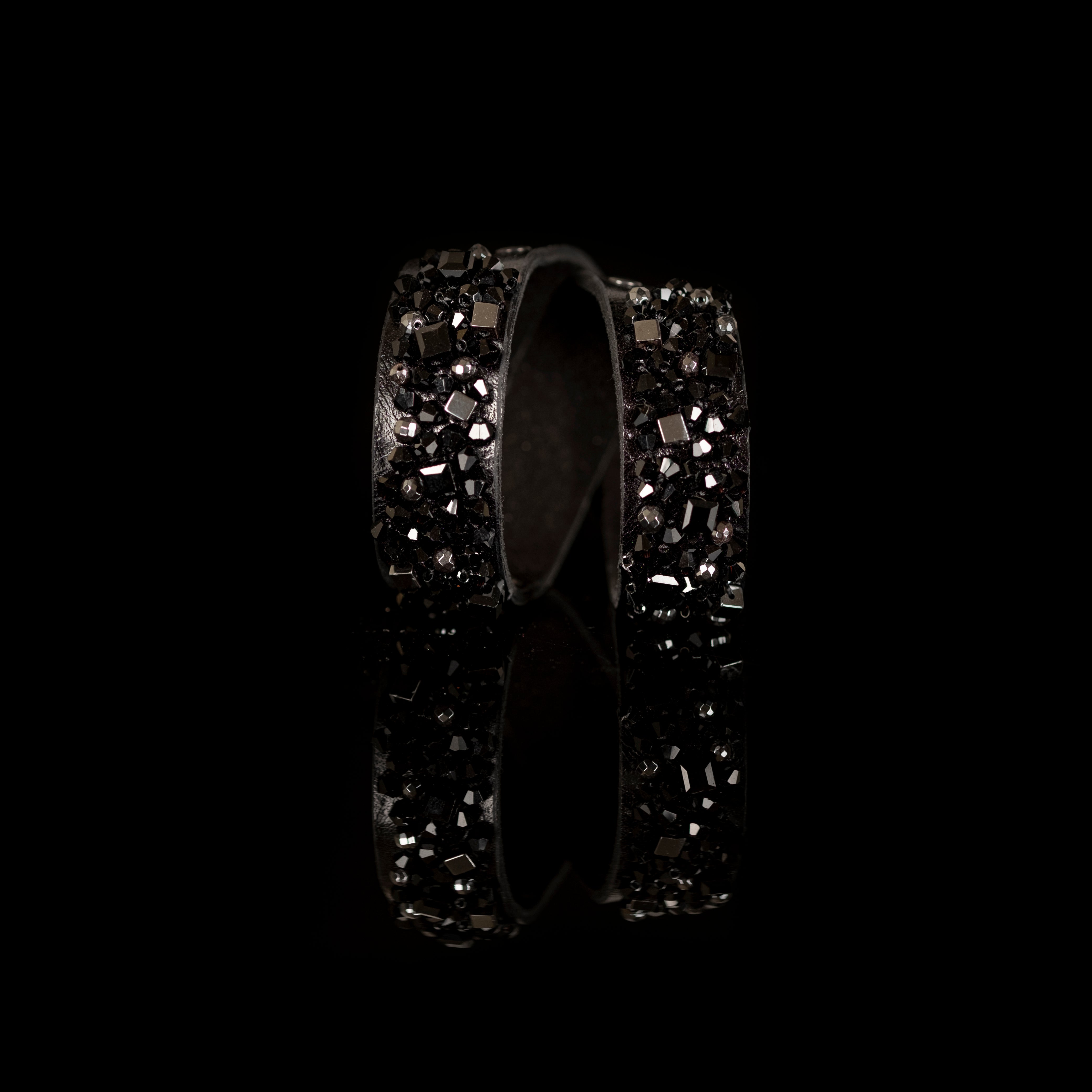 Black leather cuff bracelet with dual crystal panels and faceted black bead cluster, handmade statement bracelet by THE DARK