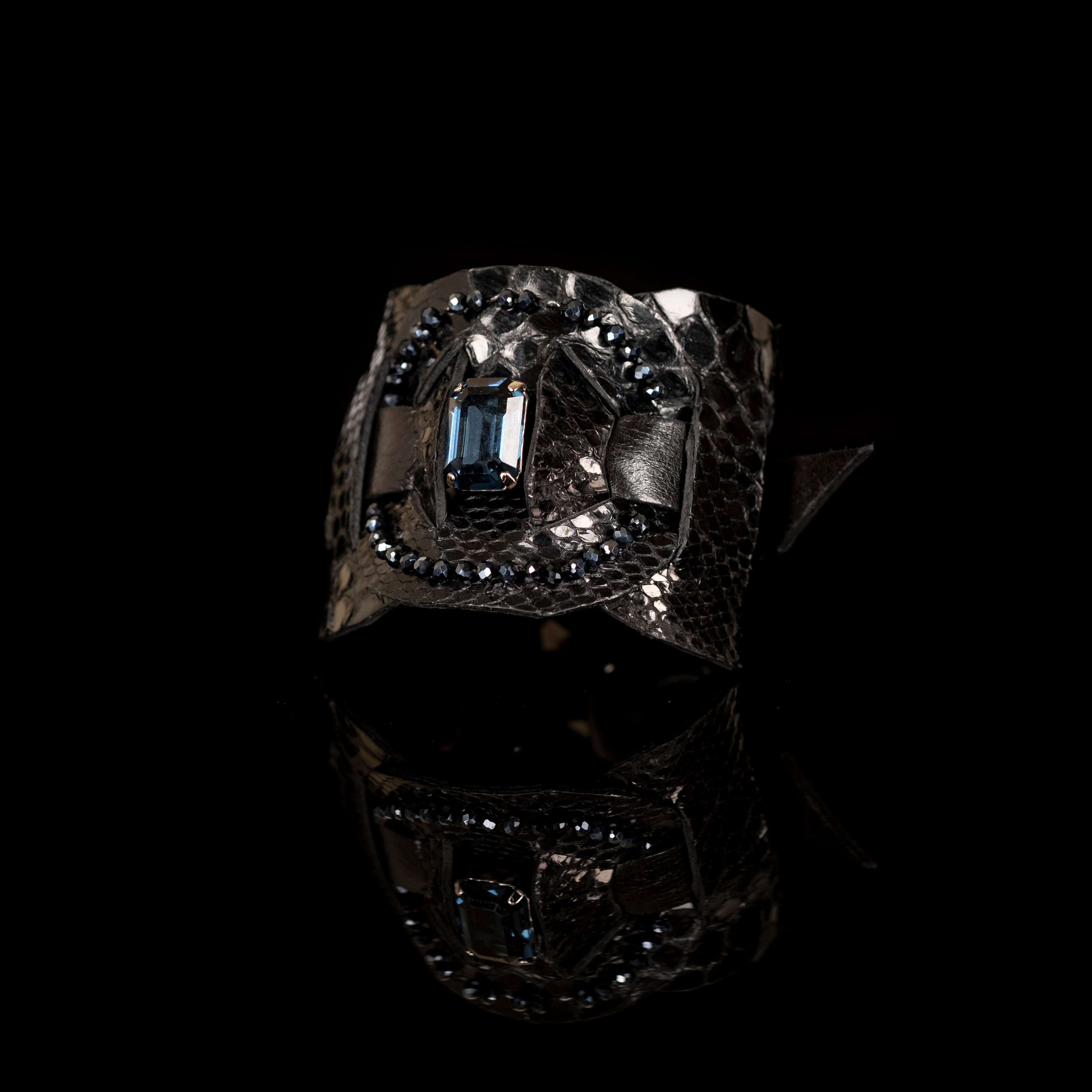 Black python leather cuff with blue crystal centerpiece and bead trim, handmade statement bracelet by THE DARK