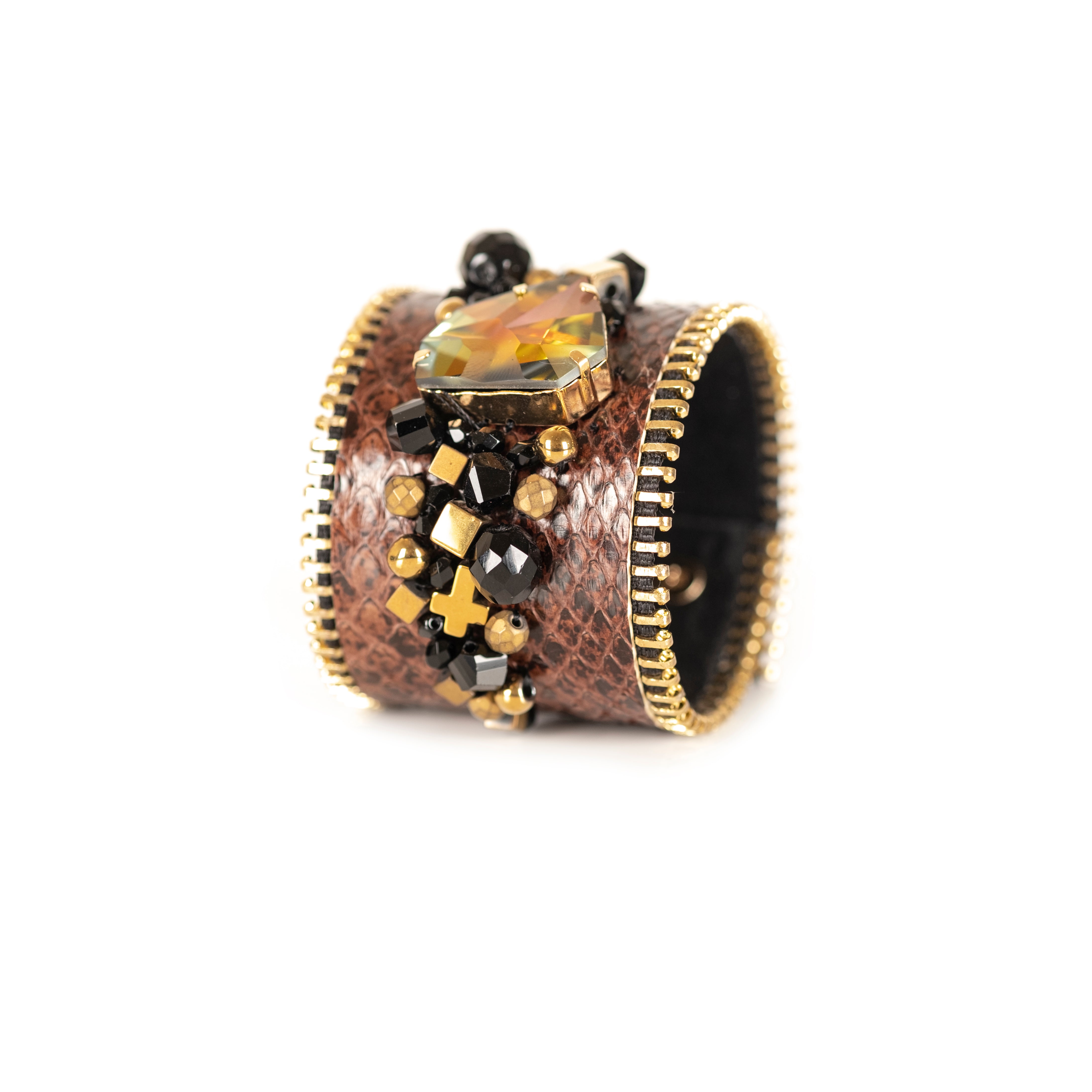 Brown python leather cuff bracelet with amber crystal centerpiece, gold zipper edges and bead embellishment, handmade by THE DARK