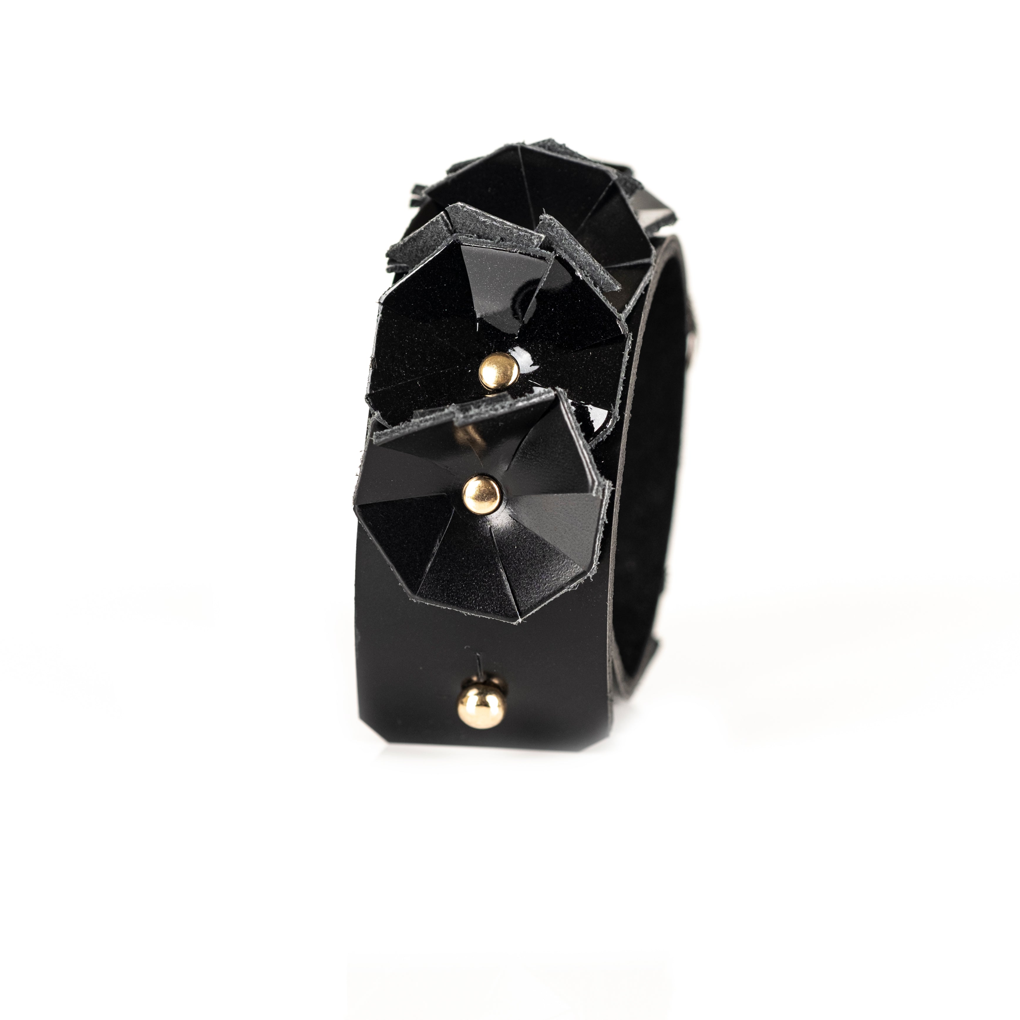 Black faceted leather cuff bracelet with geometric panels and crystal centerpiece, handmade statement bracelet by THE DARK