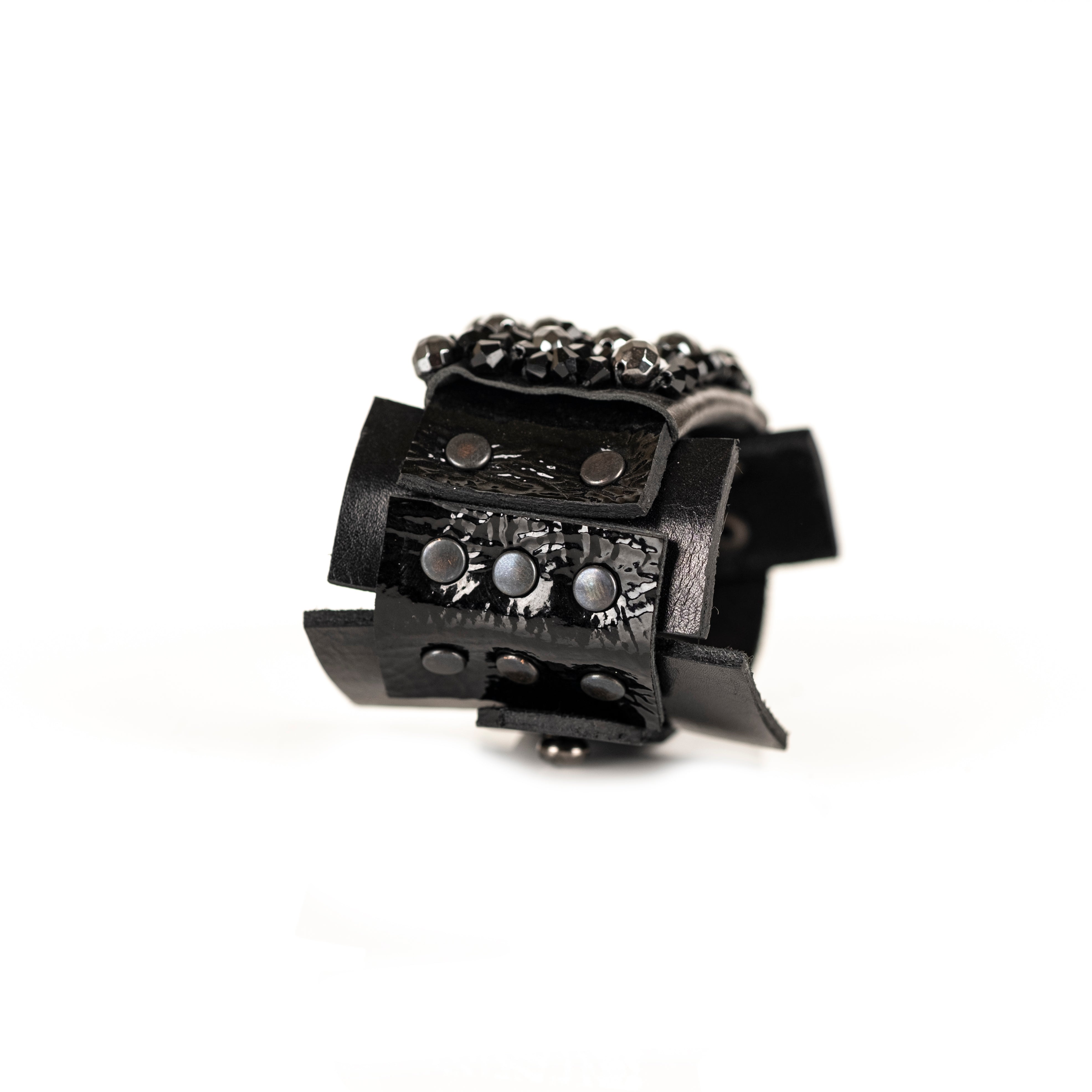 Black leather cuff bracelet with dense black crystal cluster and studded leather panels, handmade statement bracelet by THE DARK