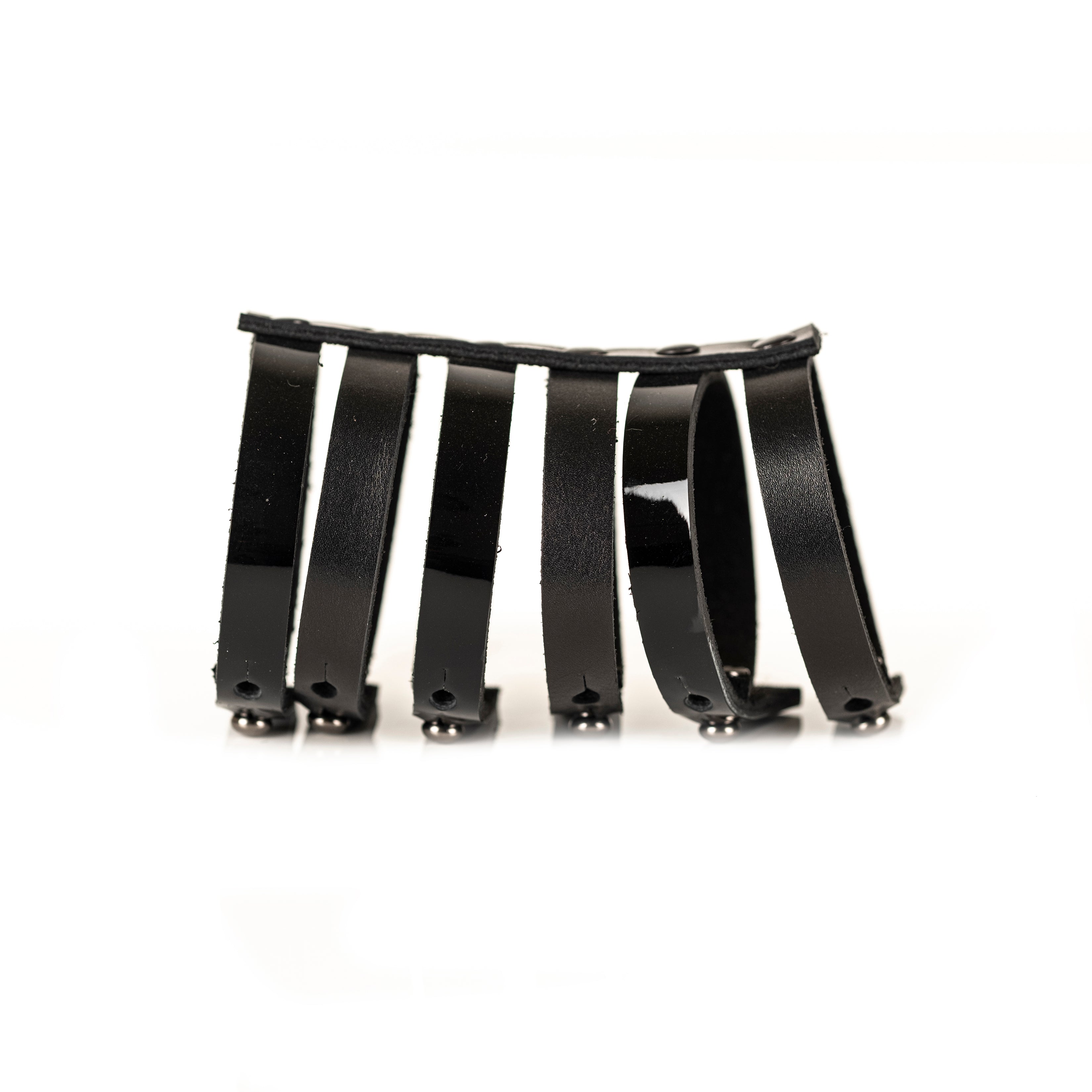 Black leather fringe bracelet with multiple hanging leather straps, handmade sculptural statement cuff by THE DARK