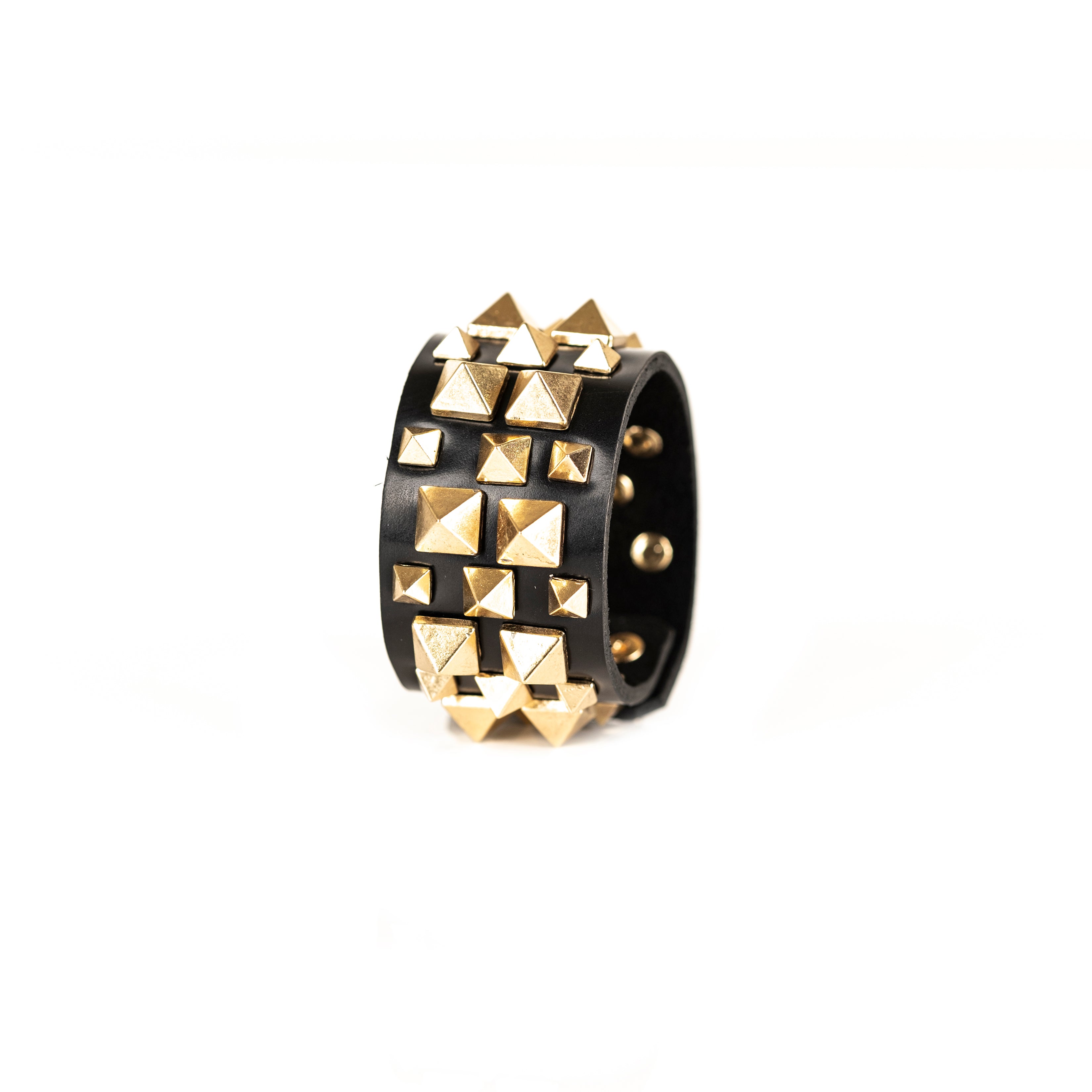 Black leather cuff bracelet with gold pyramid stud pattern, handmade statement bracelet by THE DARK