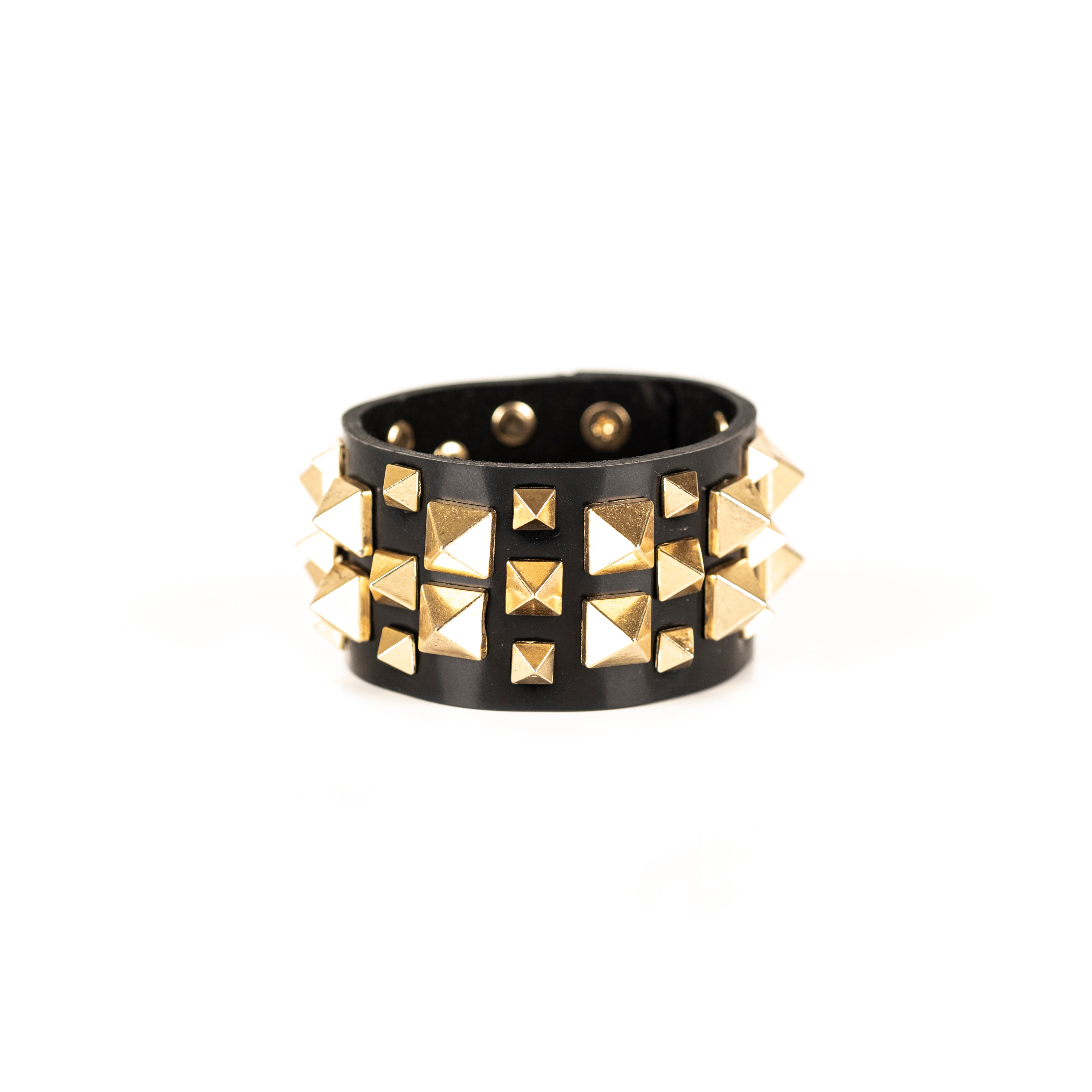 Black leather cuff bracelet with gold pyramid stud pattern, handmade statement bracelet by THE DARK