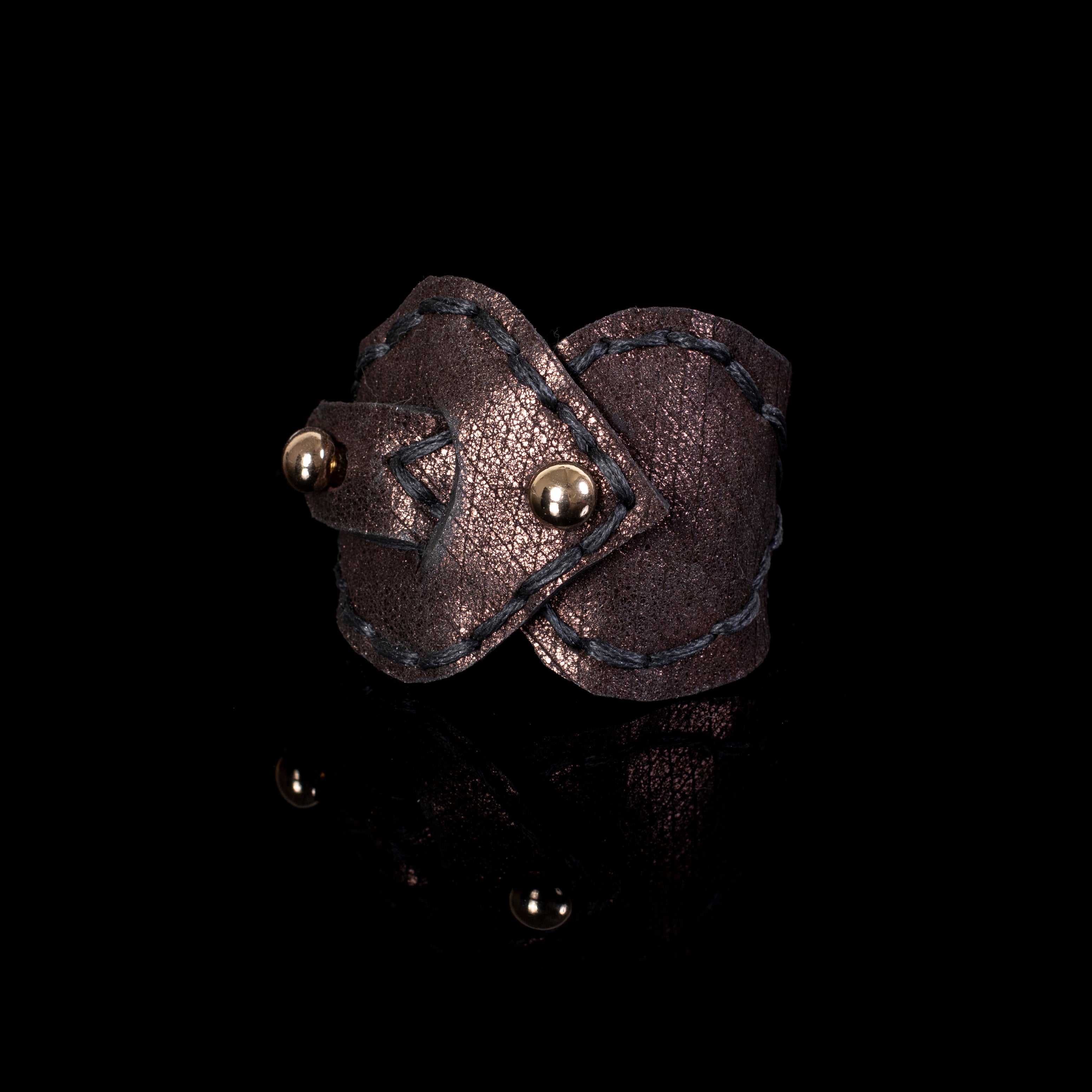 Metallic brown leather cuff bracelet with hand stitching and gold stud detail, wide statement bracelet for women