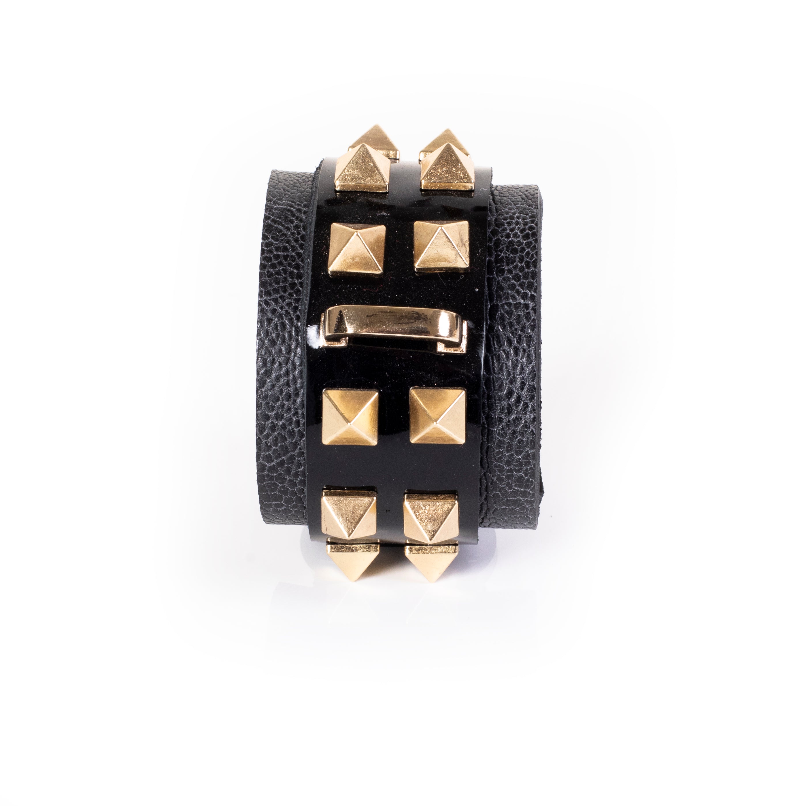Black patent leather cuff bracelet with gold pyramid studs and textured leather side panels, wide handcrafted statement bracelet for women by THE DARK