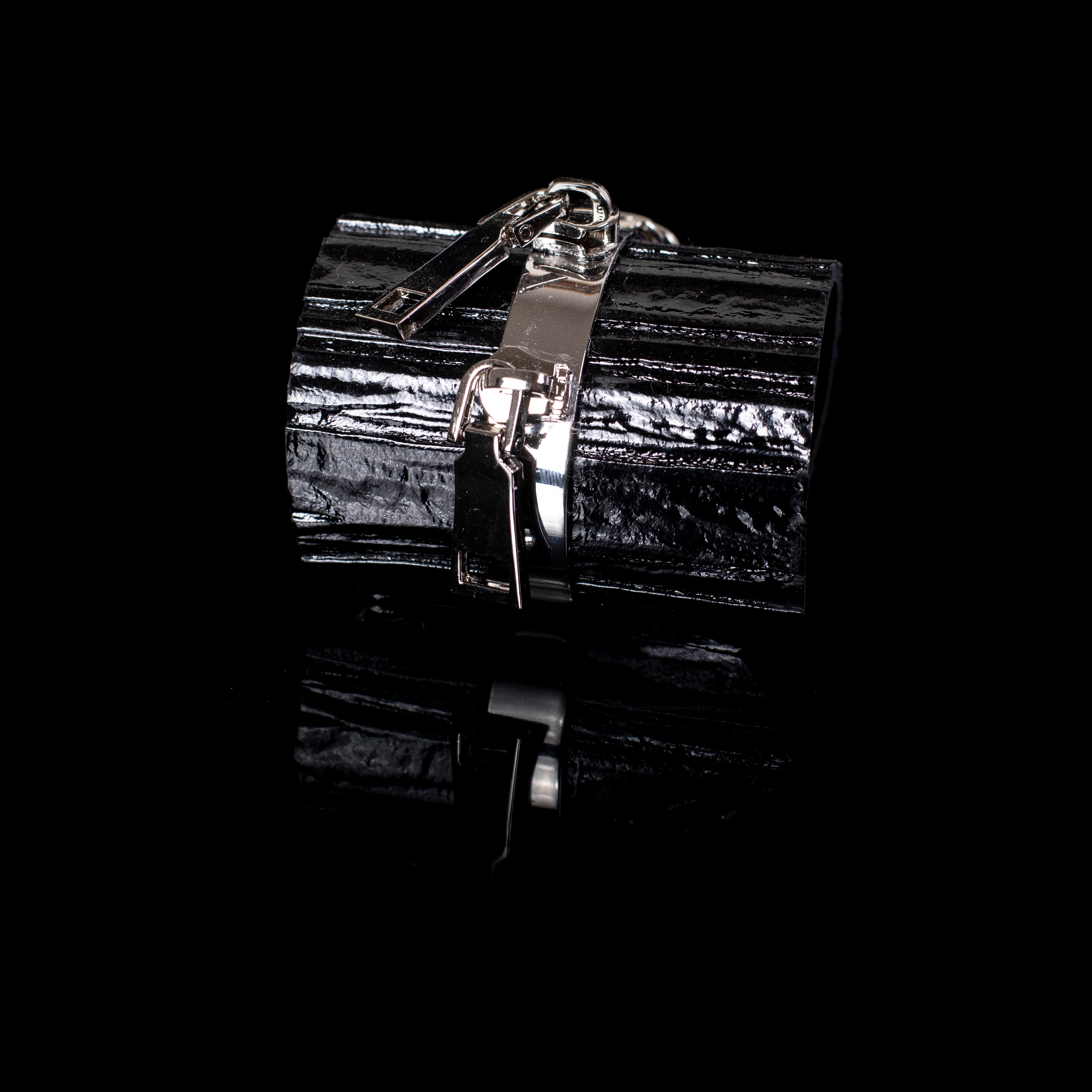 Black patent leather cuff bracelet with silver lock and zipper hardware detail, glossy wide handcrafted statement bracelet for women by THE DARK