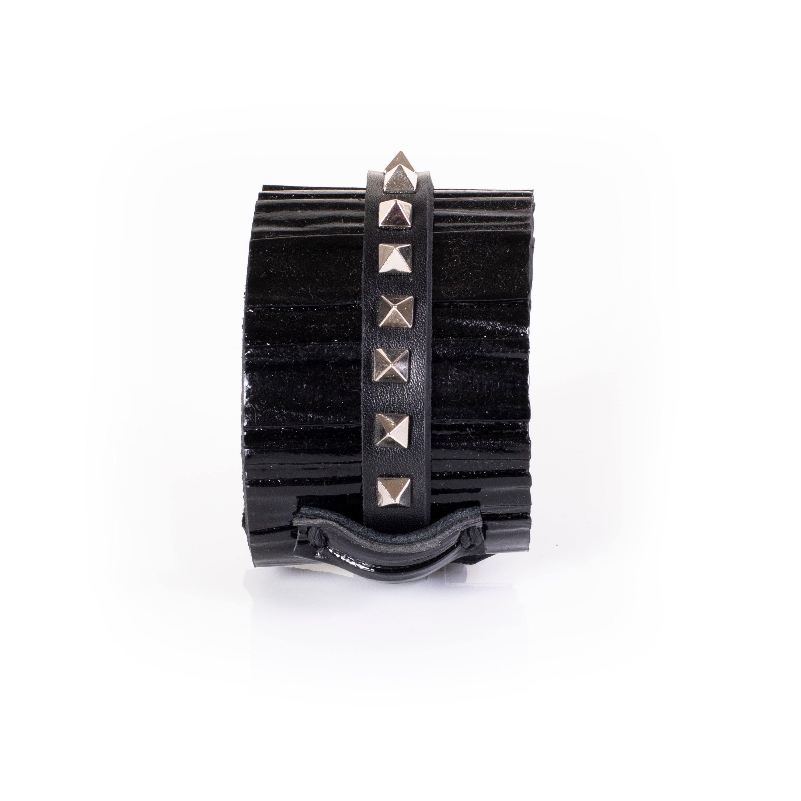 Black patent leather cuff bracelet with central studded leather strap and textured glossy surface, handcrafted wide statement bracelet for women by THE DARK