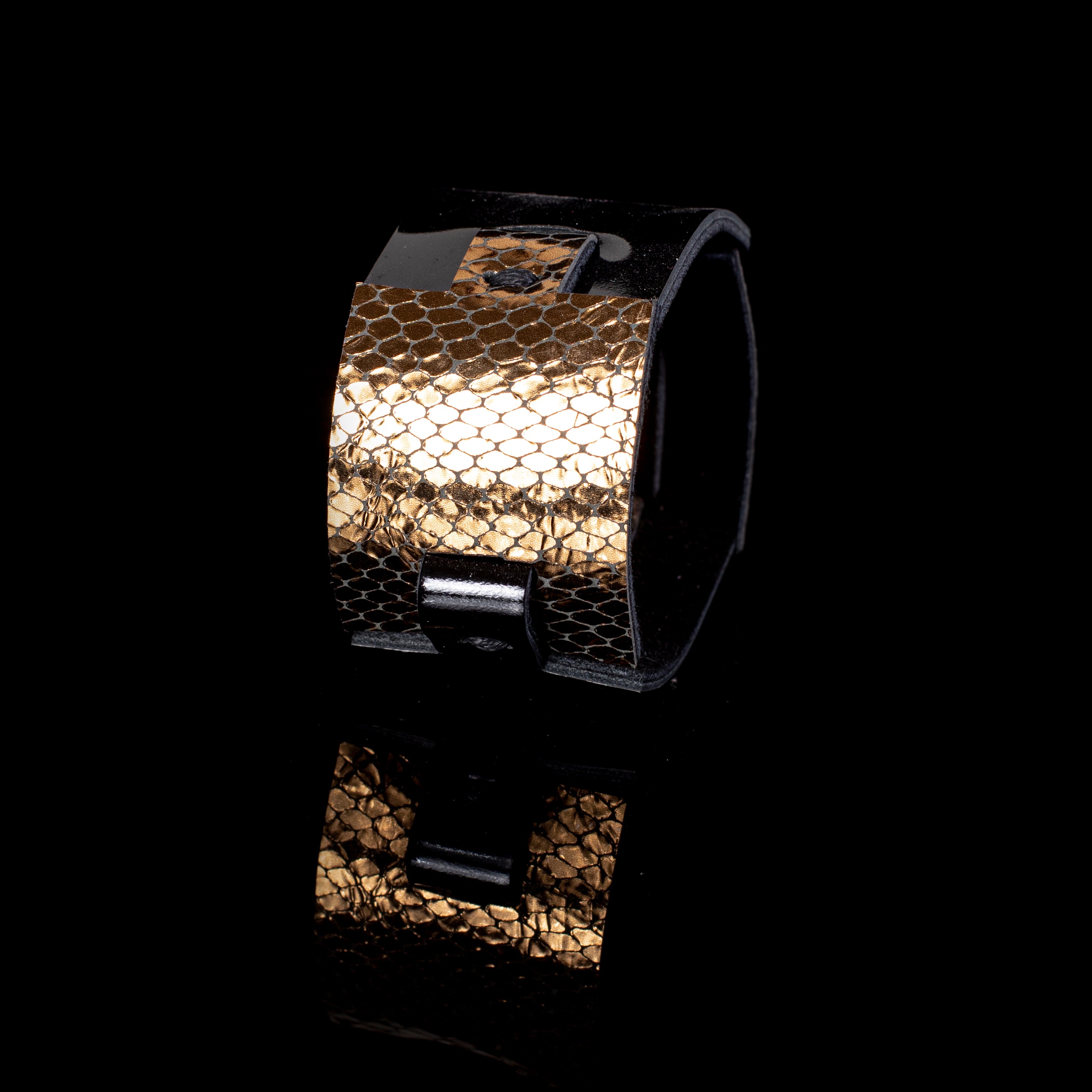 Black leather cuff bracelet with gold python textured panel and clean structured design, handcrafted wide statement bracelet for women by THE DARK