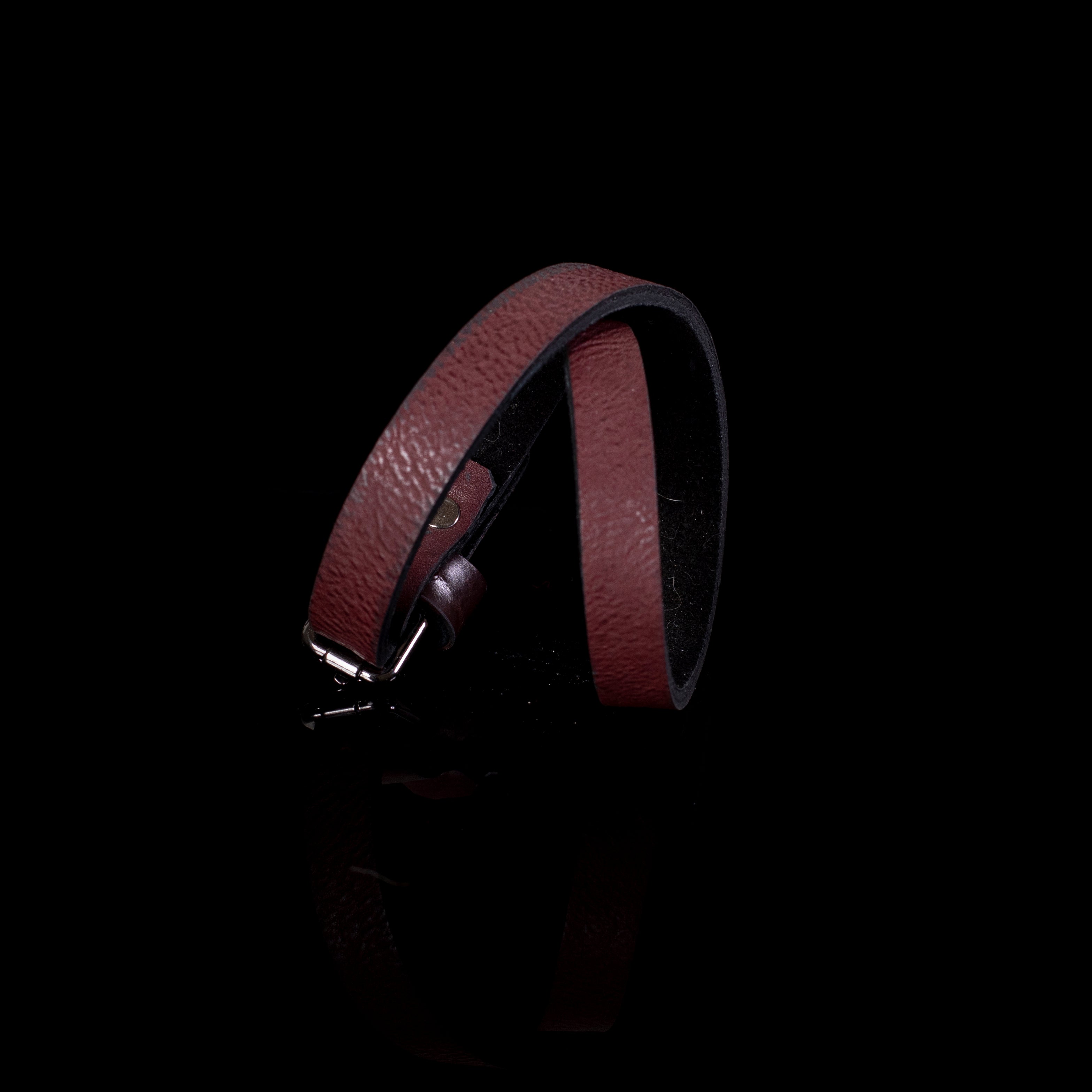 Brown leather cuff bracelet with simple minimalist design and buckle closure, handcrafted slim wristband for women