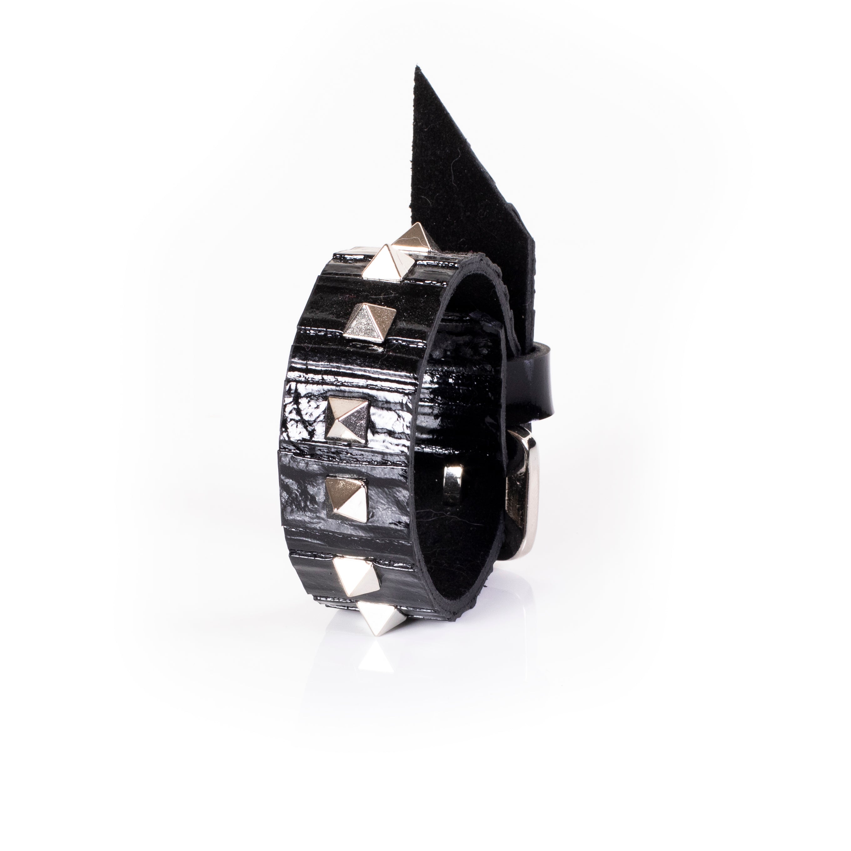 Black patent leather cuff bracelet with pyramid studs and pointed spike detail, wide handcrafted statement bracelet for women by THE DARK