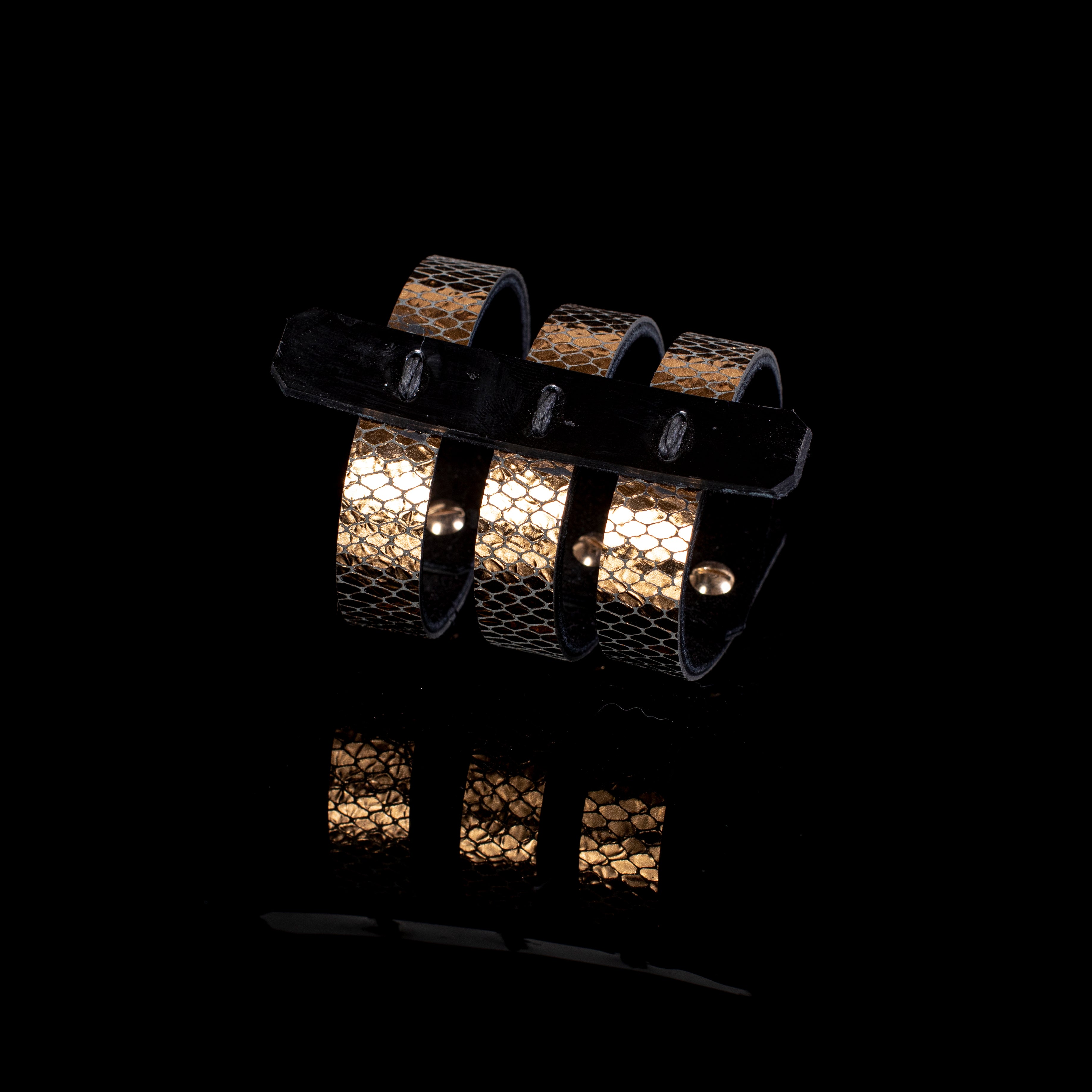 Gold python textured leather cuff bracelet with black leather top strap and multi-band design, handcrafted statement bracelet for women by THE DARK