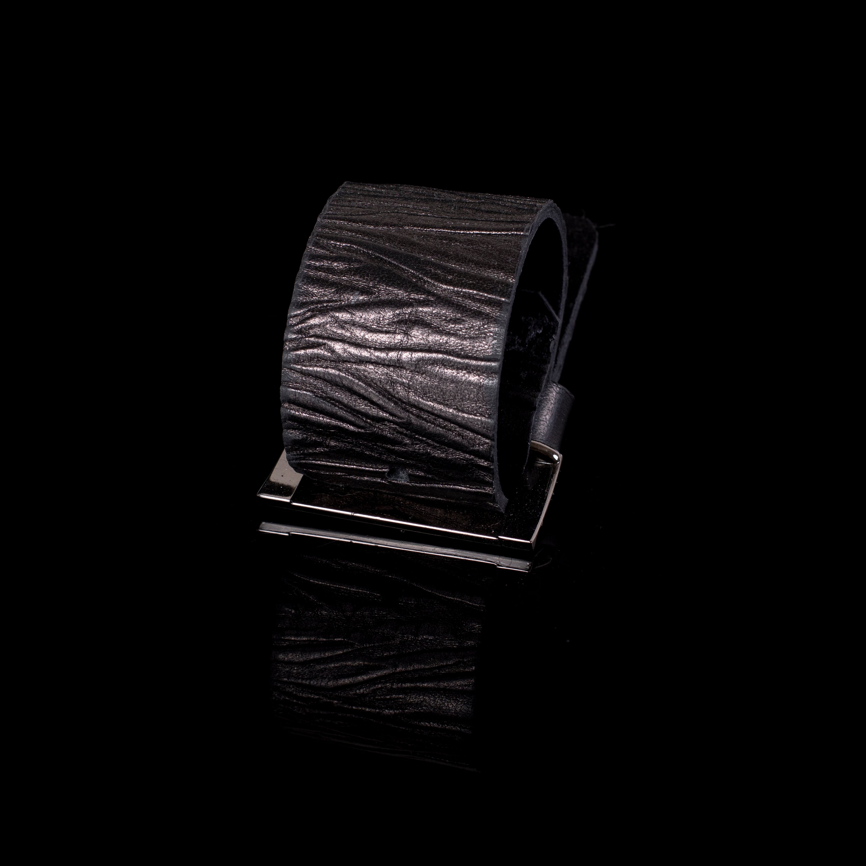 Wide black leather cuff bracelet with natural textured finish, minimalist handcrafted statement piece