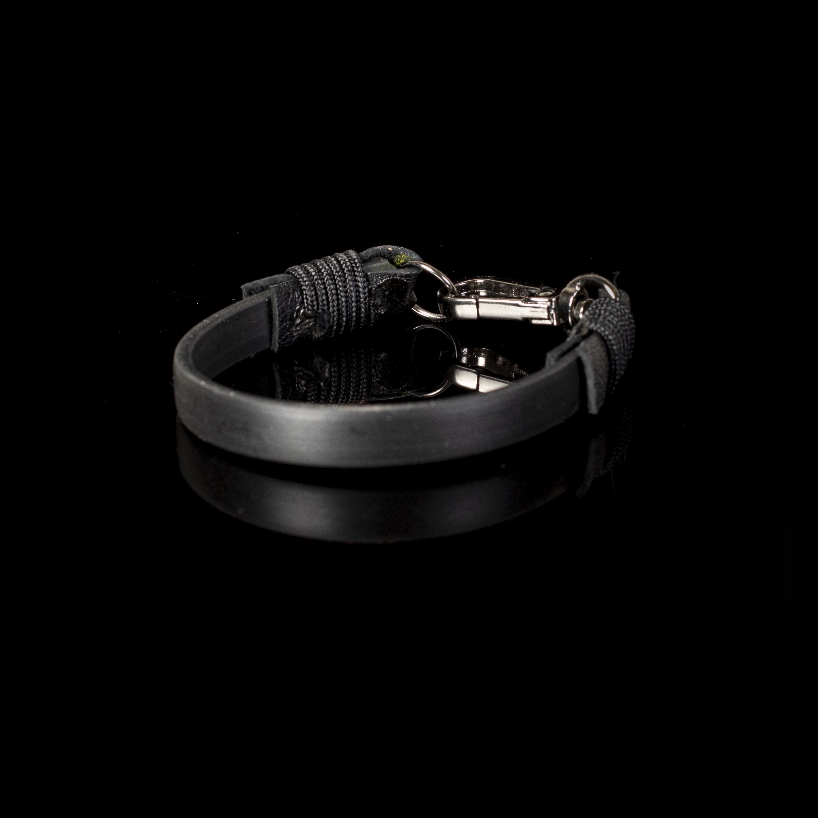 Handmade black minimalist leather bracelet with polished hook clasp and smooth leather band.