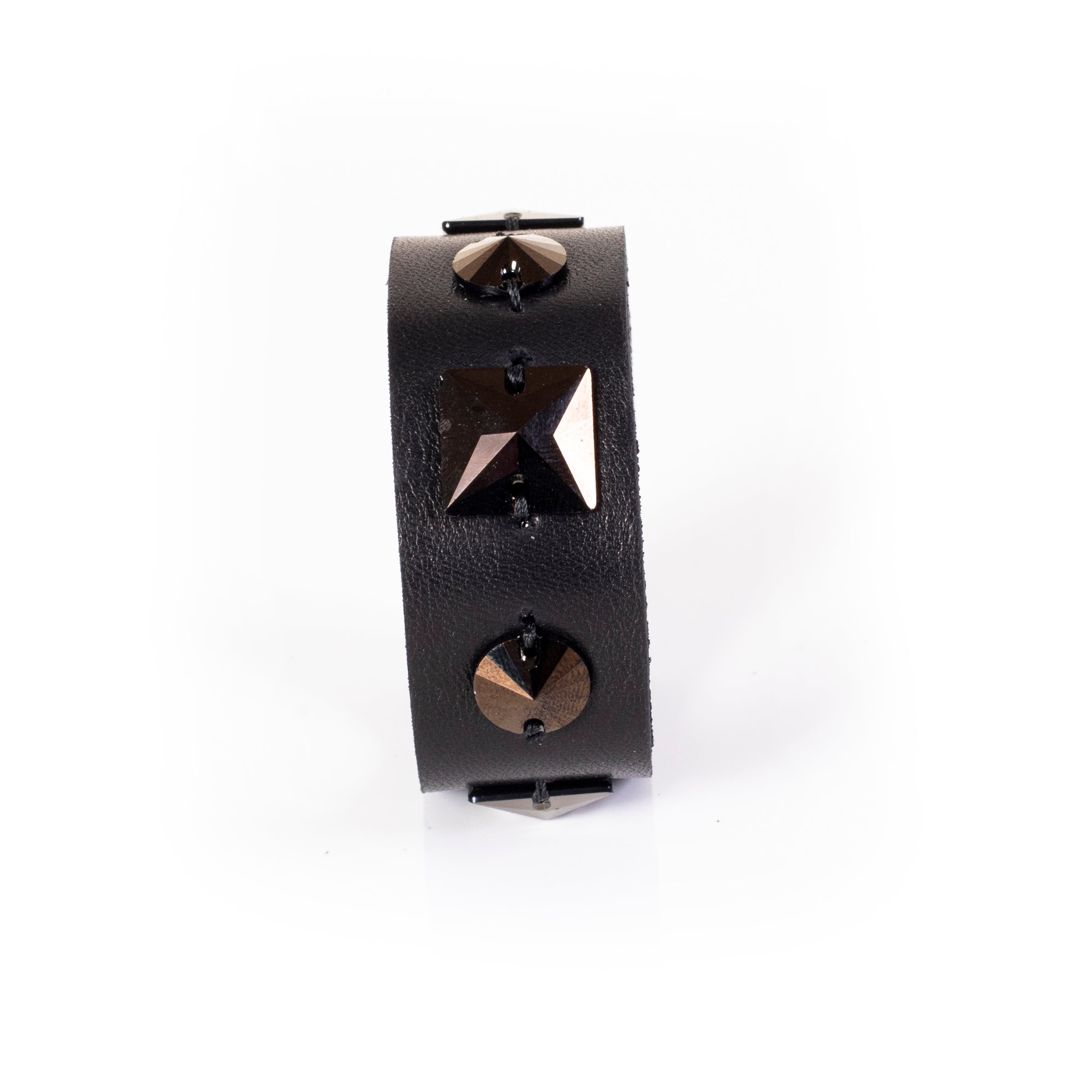 Black leather cuff bracelet with geometric metal studs and pyramid detail, handcrafted wide statement bracelet for women