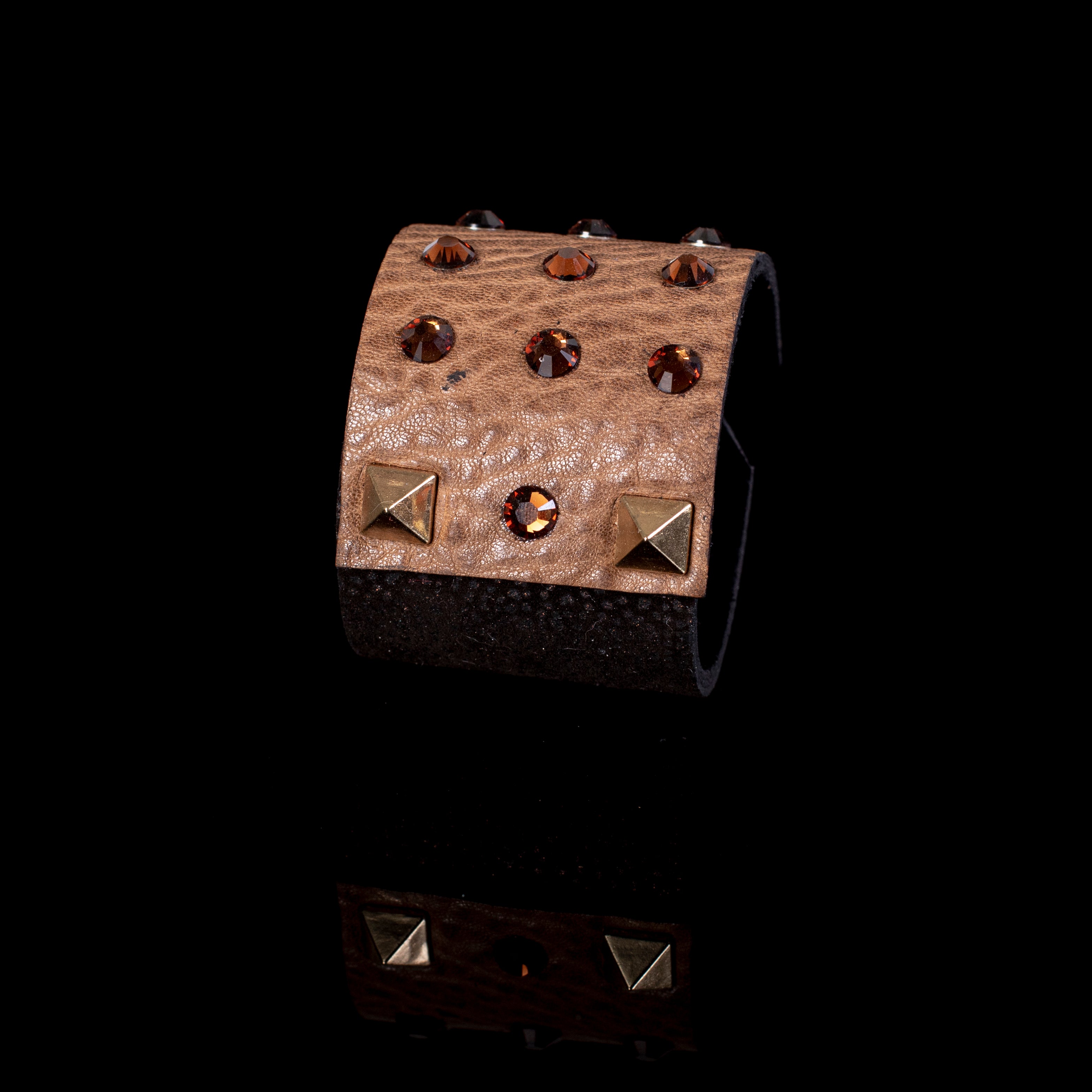Brown leather cuff bracelet with amber crystals and gold stud accents, wide layered handcrafted statement piece
