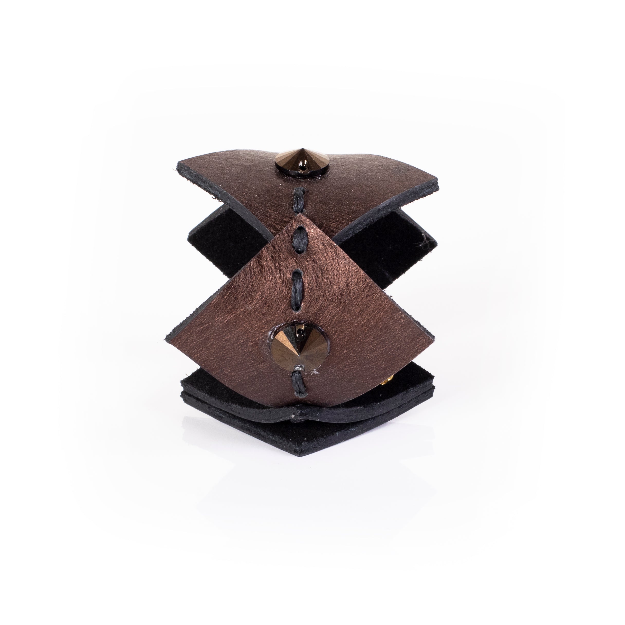 Brown sculptural leather cuff bracelet with layered curved panels and spike stud accents, bold handcrafted statement piece
