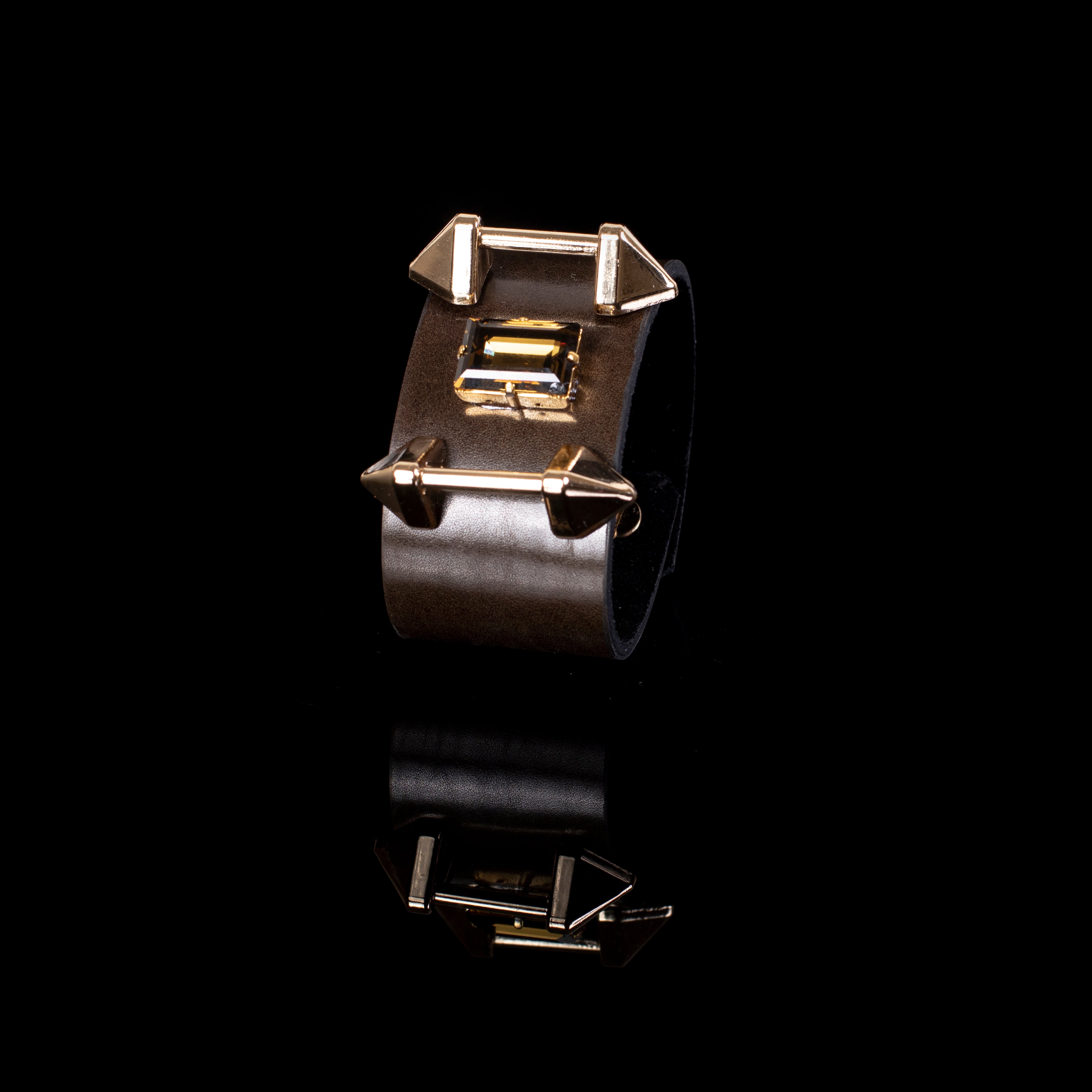 Brown leather cuff bracelet with gold bar hardware and crystal detail, handcrafted wide statement bracelet for women