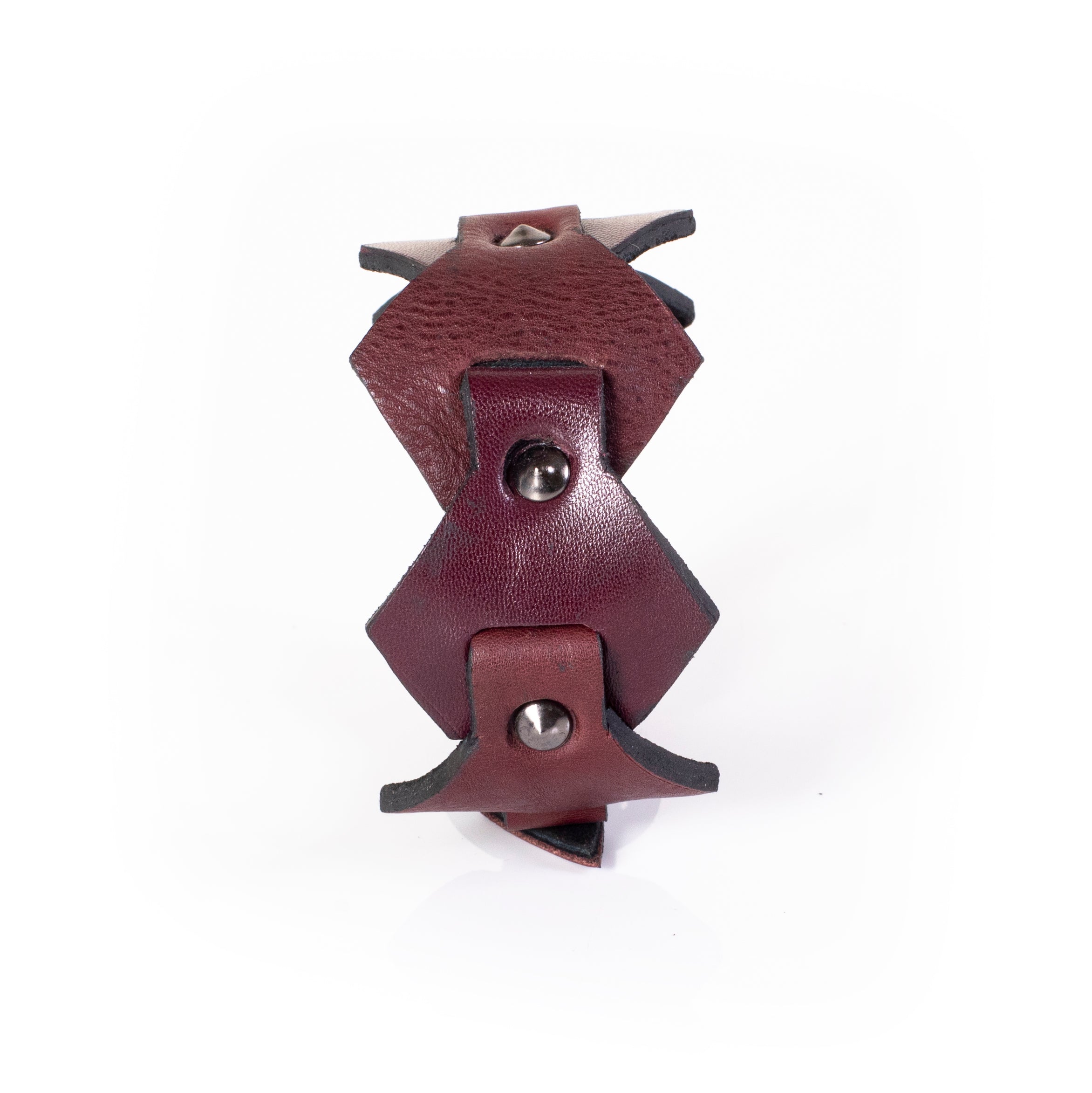Burgundy leather cuff bracelet with layered geometric panels and metal studs, handcrafted wide statement bracelet for women