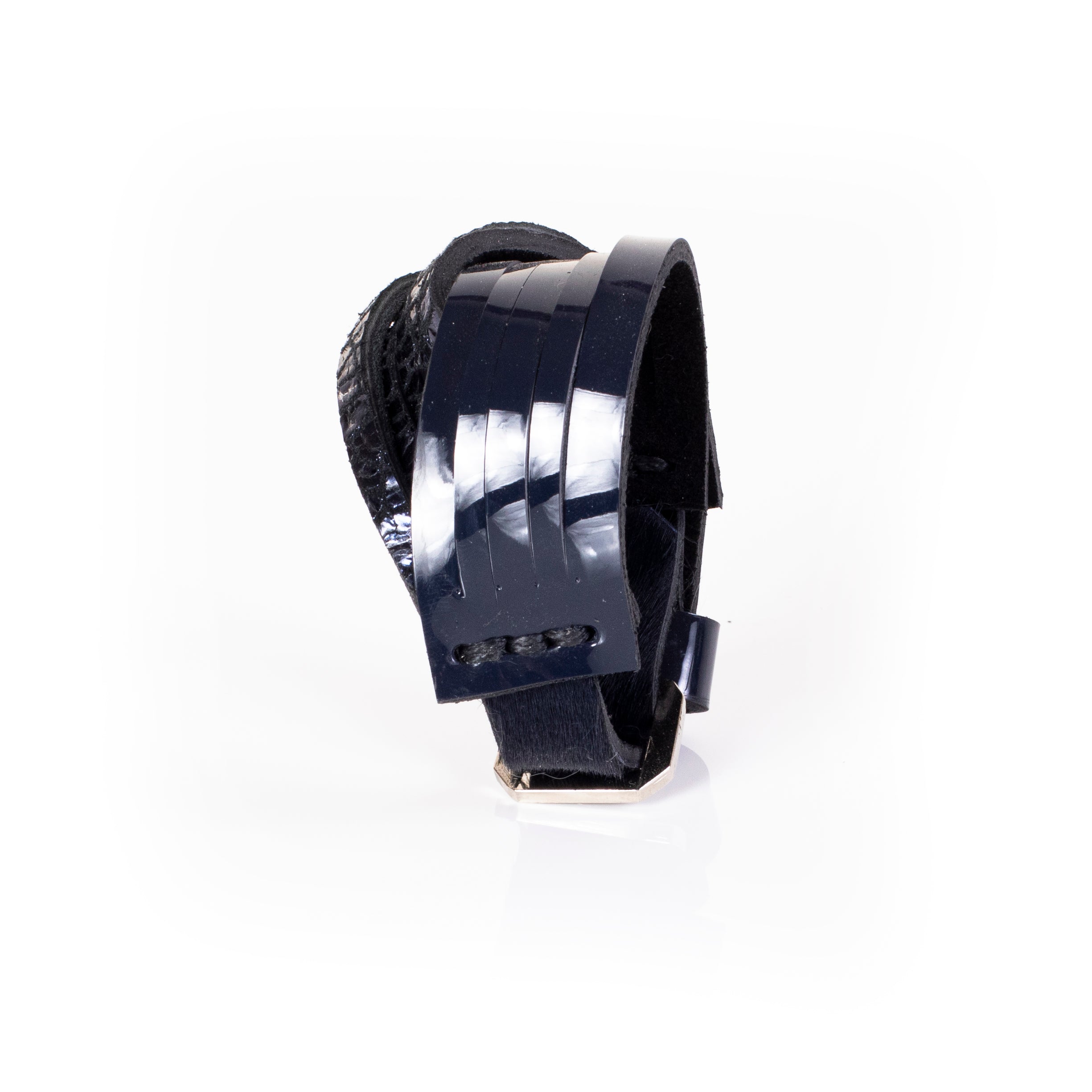 Black patent leather cuff bracelet with glossy linear panel design and layered leather construction, handcrafted wide statement bracelet for women by THE DARK
