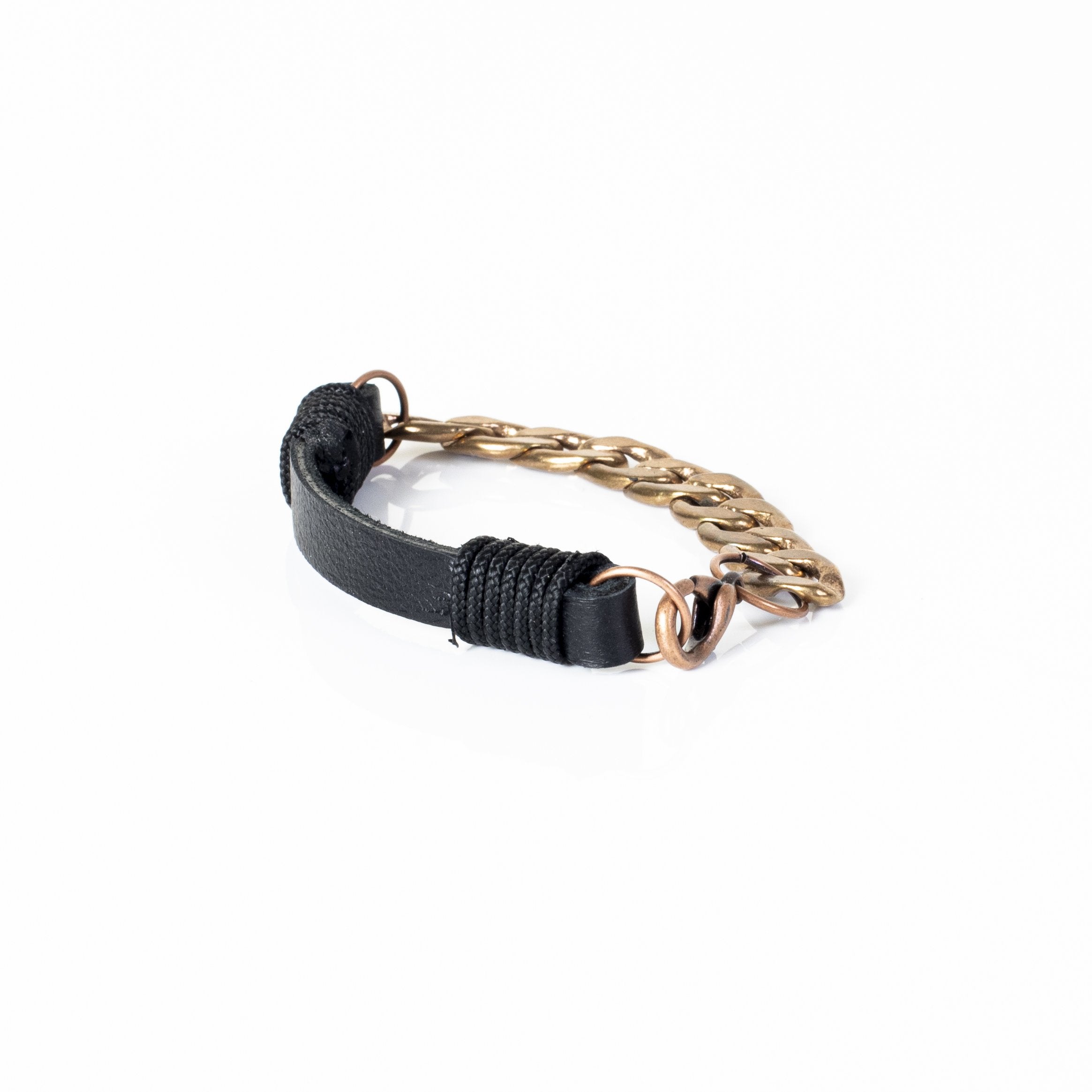 Handmade black leather bracelet featuring an antique gold-tone curb chain and adjustable clasp in an industrial-inspired design.