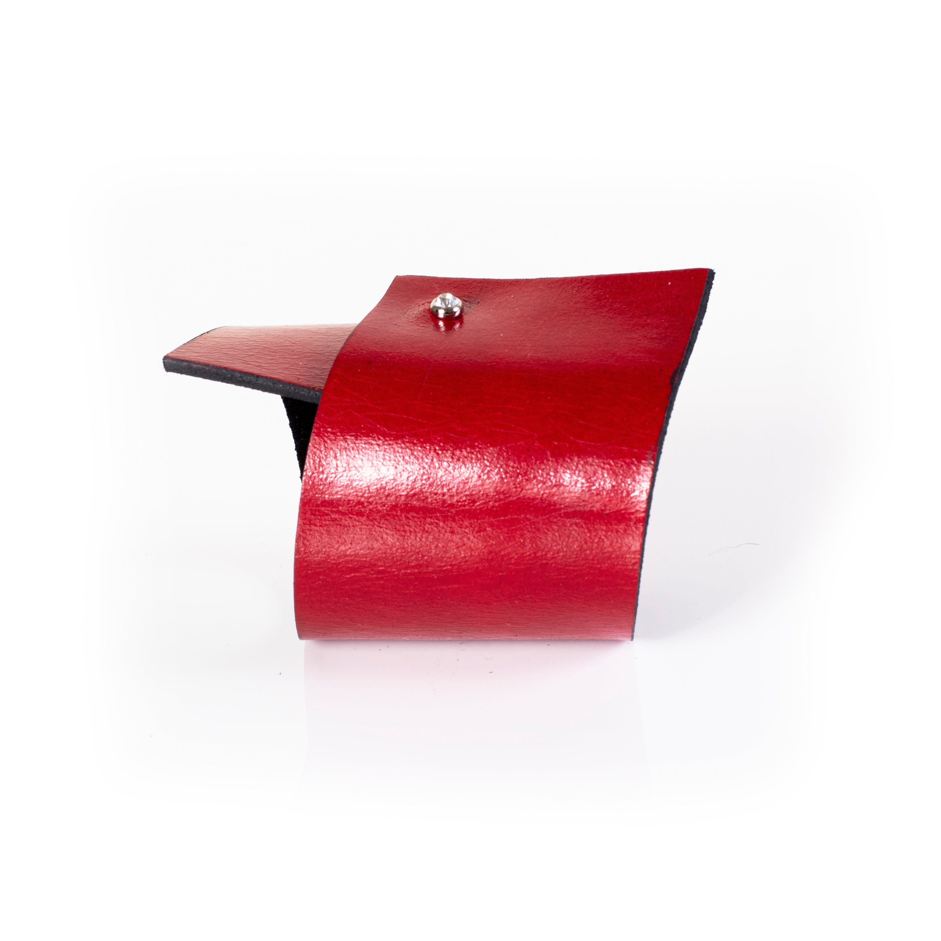 Red leather cuff bracelet with layered panel design and stud detail, handcrafted wide statement bracelet for women