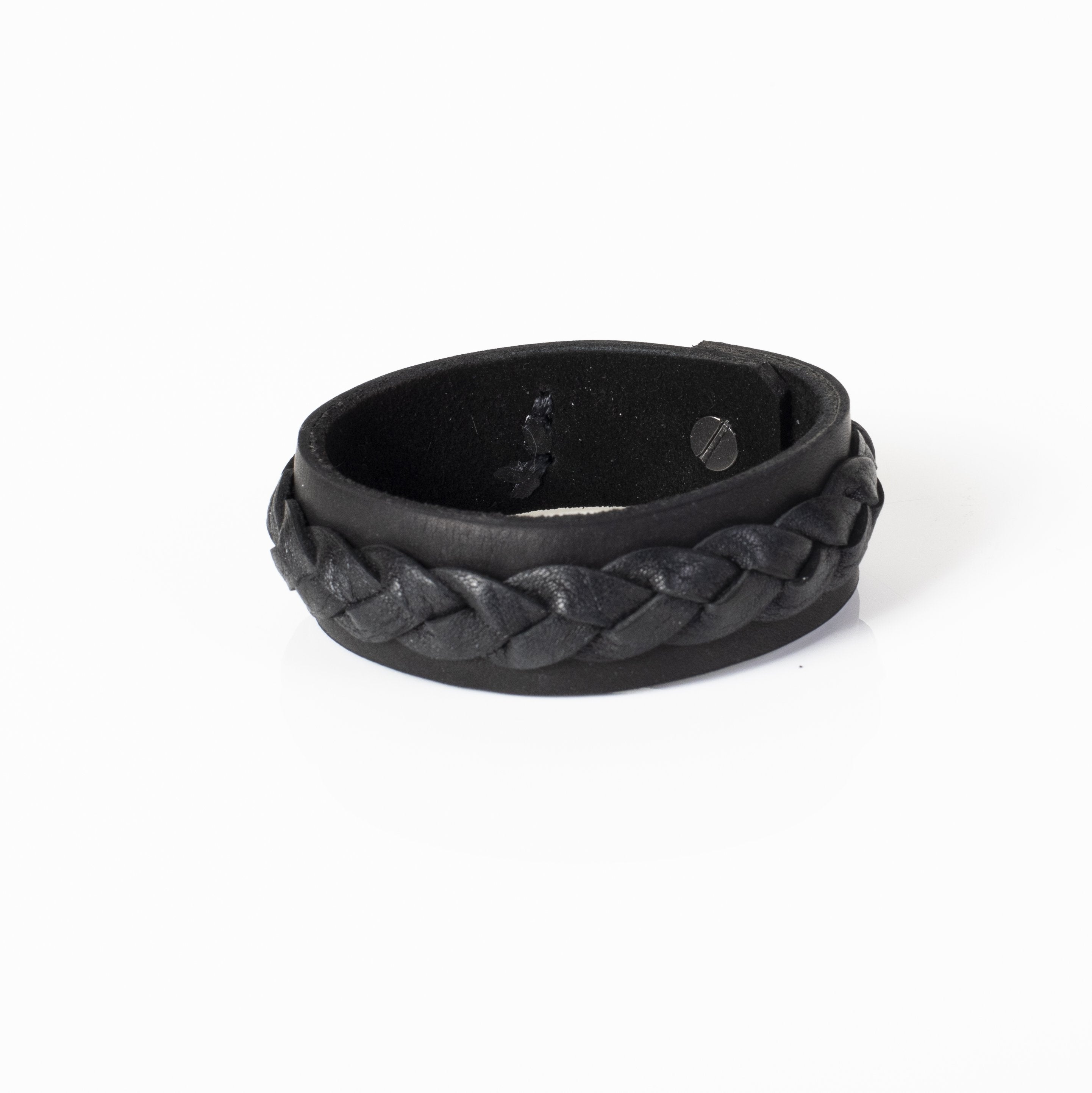 Handmade black leather cuff bracelet featuring a raised braided leather detail on a wide leather band.