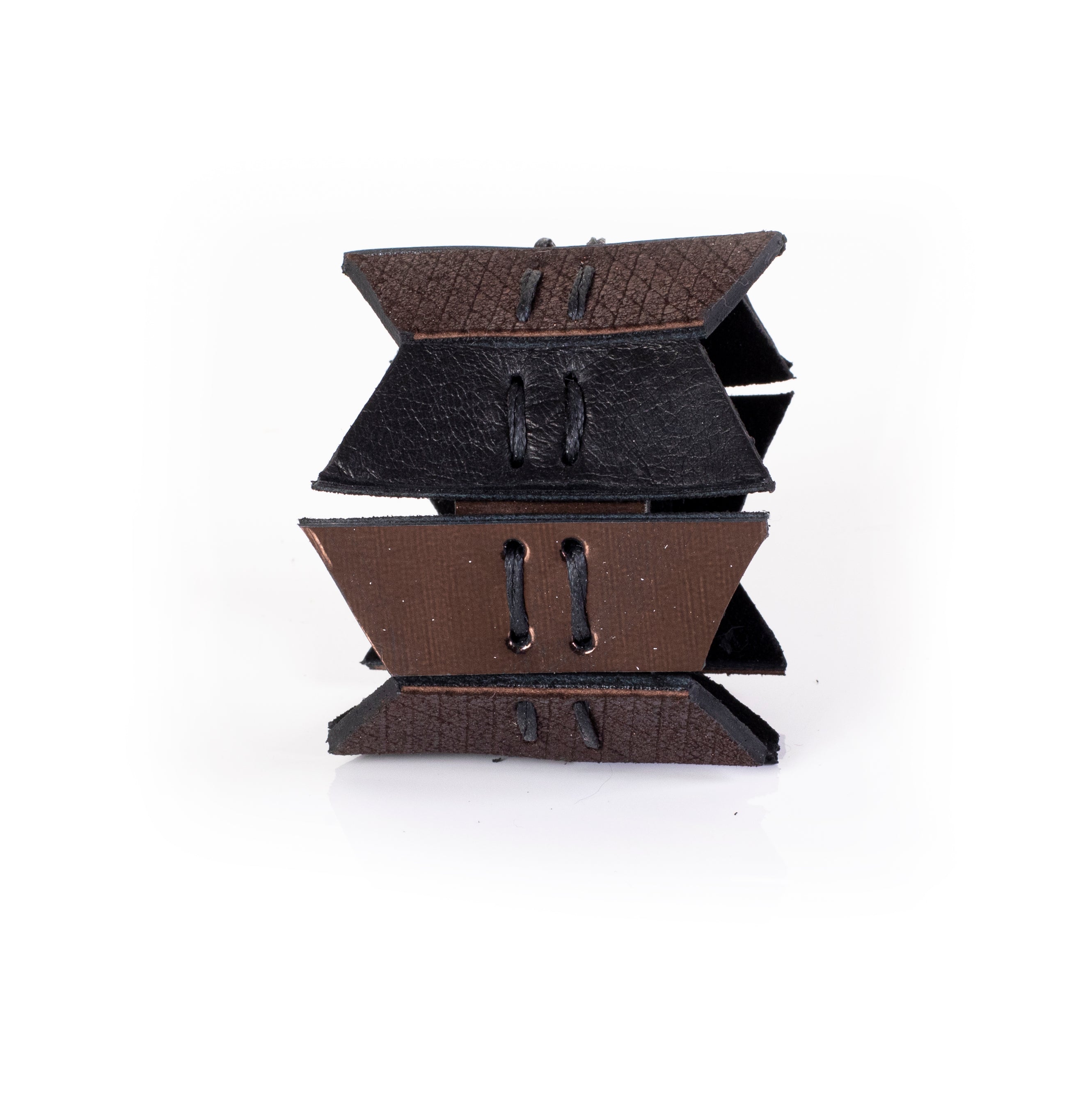Black and bronze leather cuff bracelet with layered geometric panels and visible stitching, handcrafted wide statement bracelet for women