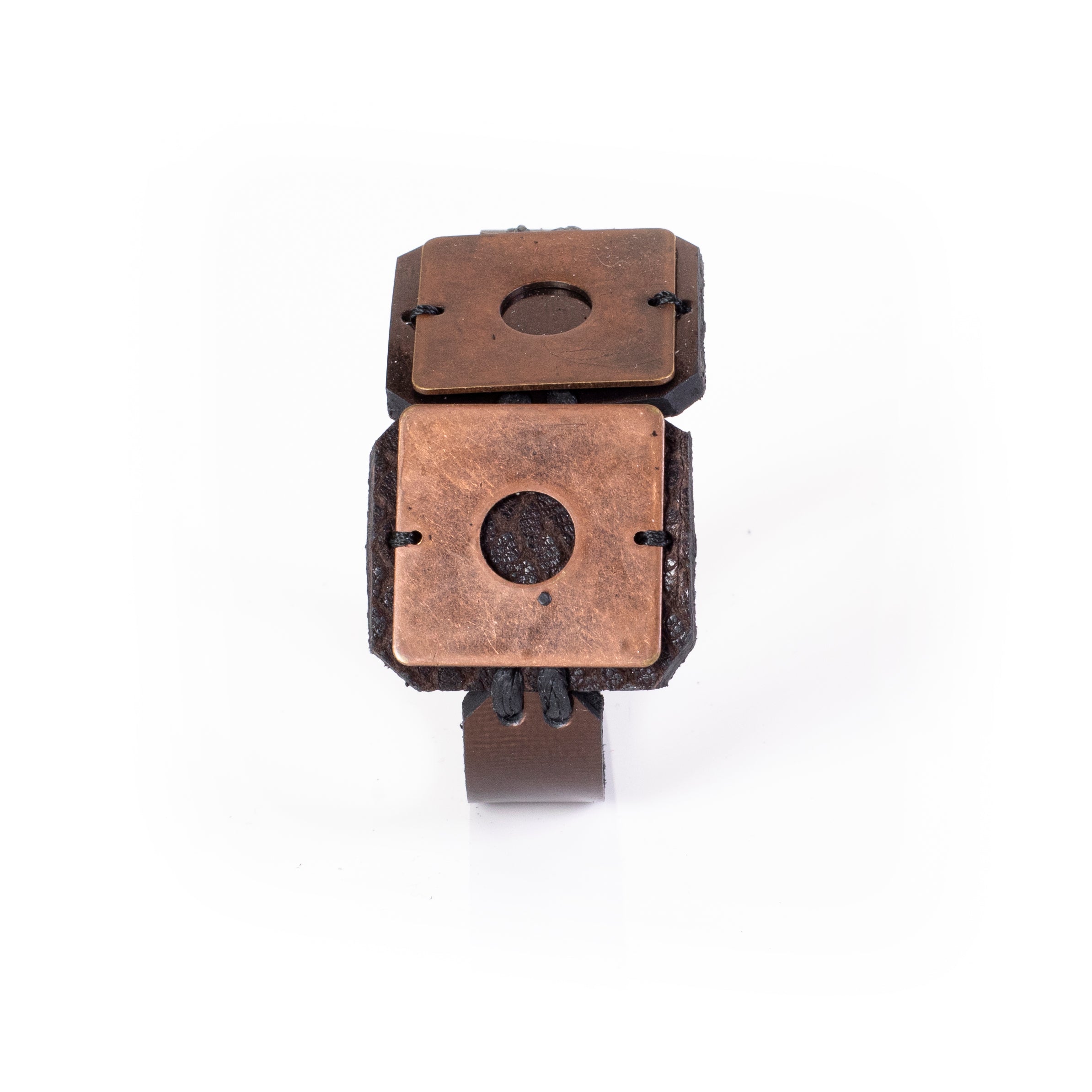 Black leather cuff bracelet with copper square plates and circular cutouts, handcrafted industrial statement bracelet for women