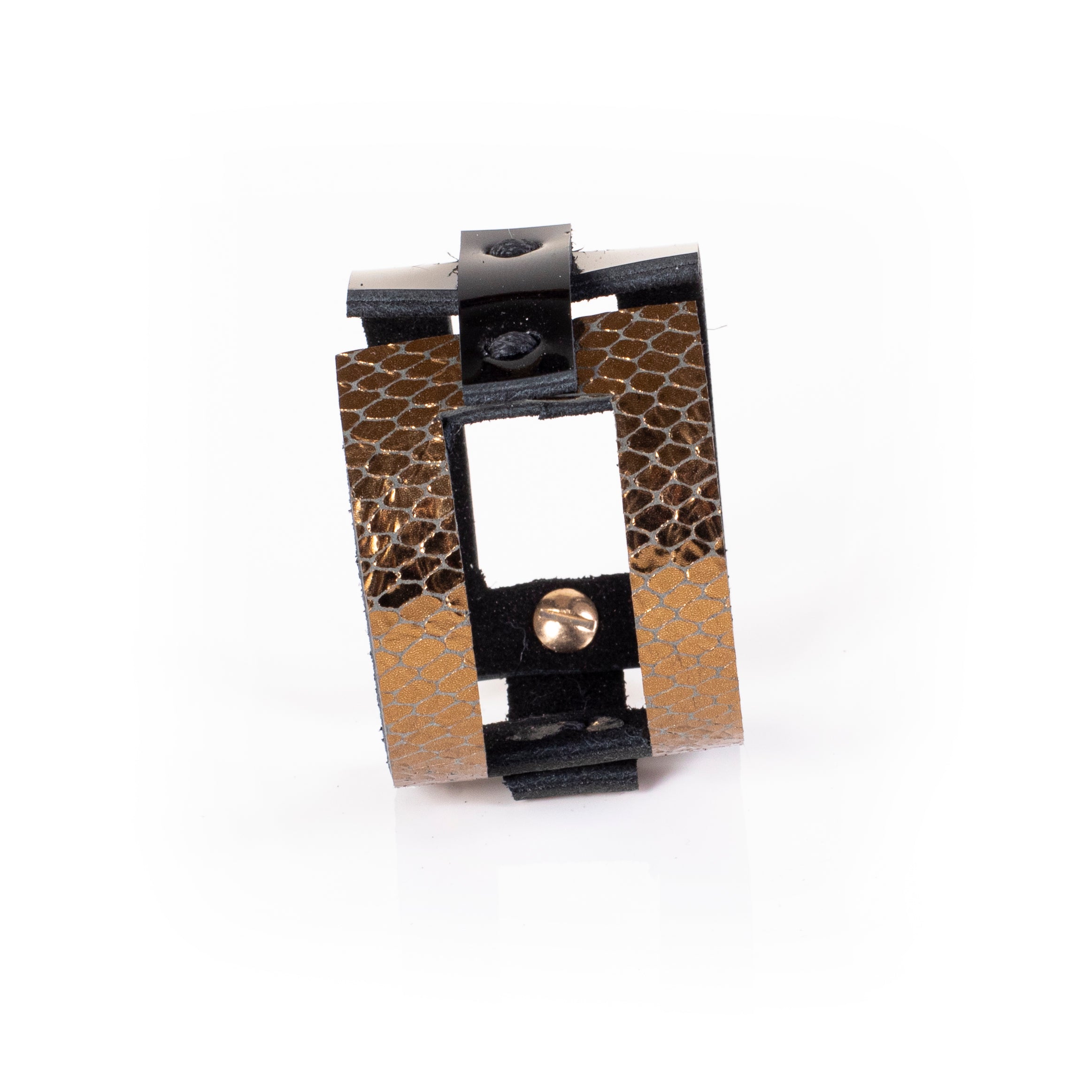 Black leather sculptural cuff bracelet with vertical gold python textured bands and open architectural design, handcrafted statement bracelet for women by THE DARK