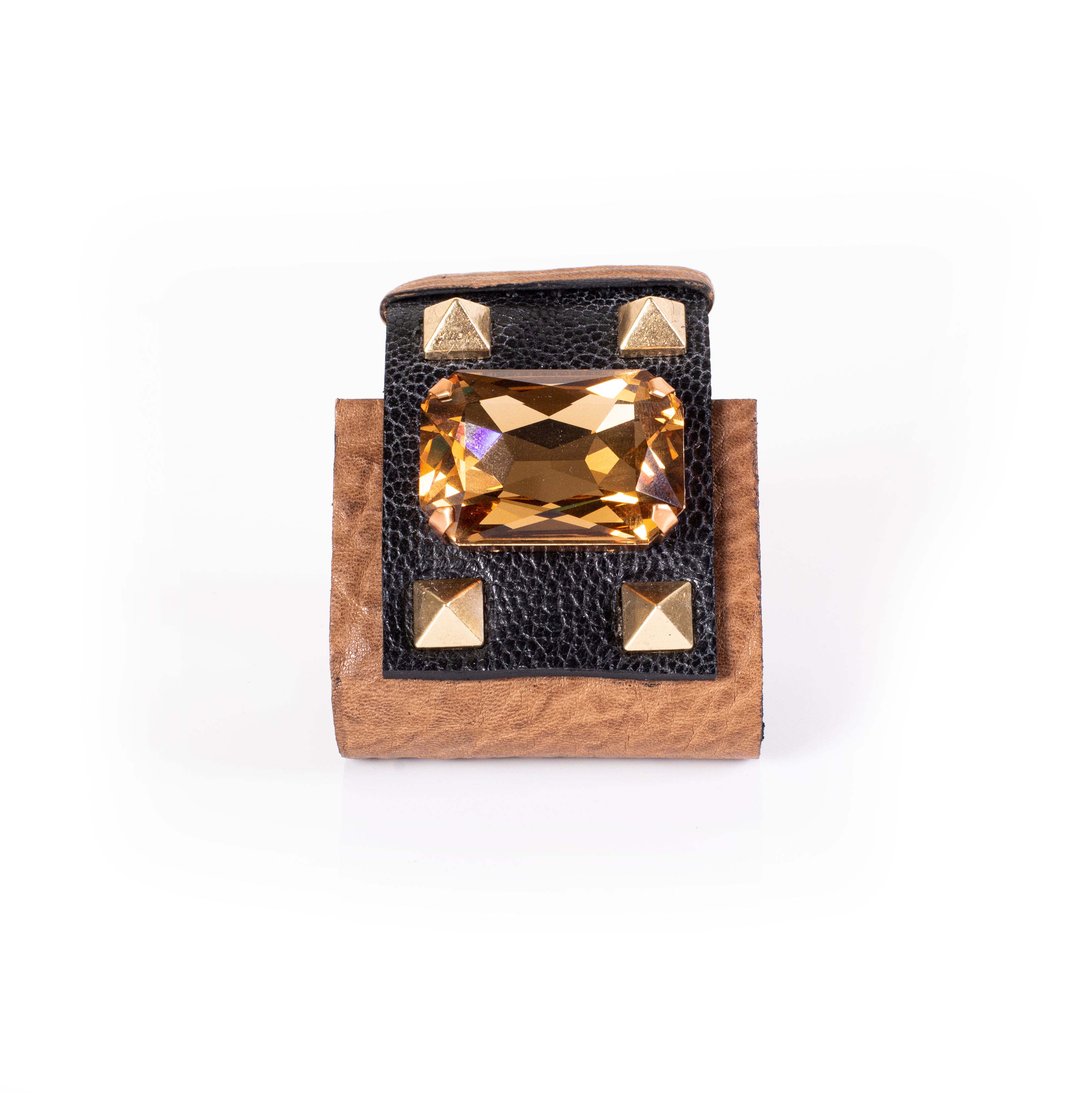 Brown leather cuff bracelet with large amber crystal centerpiece and gold stud accents, bold handcrafted statement piece