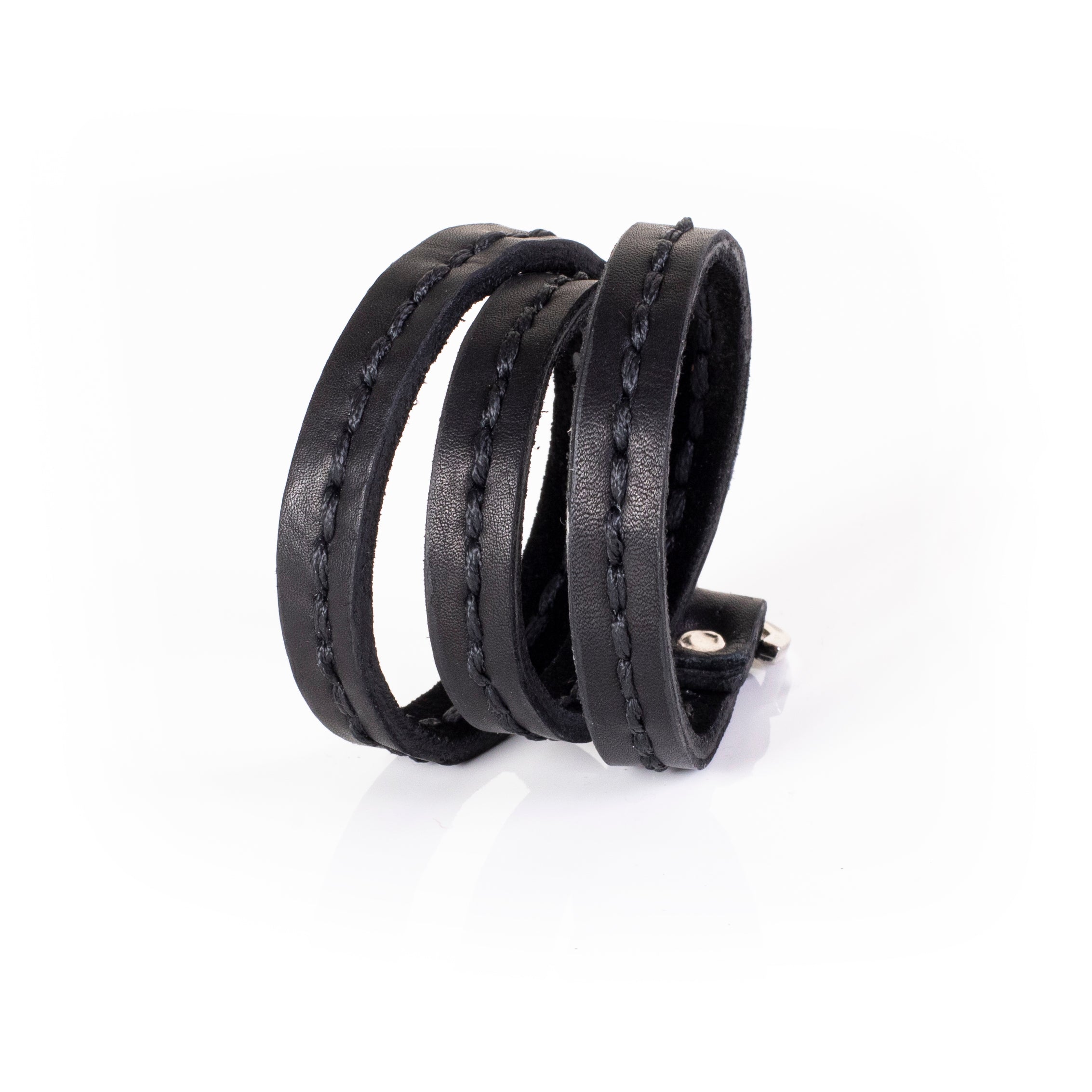 Black leather triple wrap bracelet with visible hand stitching and layered slim straps, handcrafted minimalist bracelet for women by THE DARK
