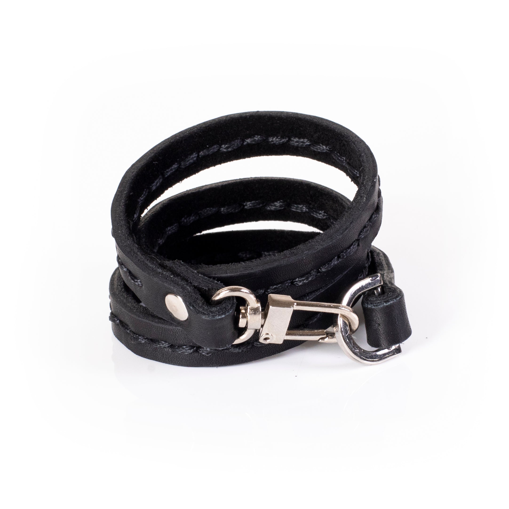 Black leather triple wrap bracelet with visible hand stitching and layered slim straps, handcrafted minimalist bracelet for women by THE DARK
